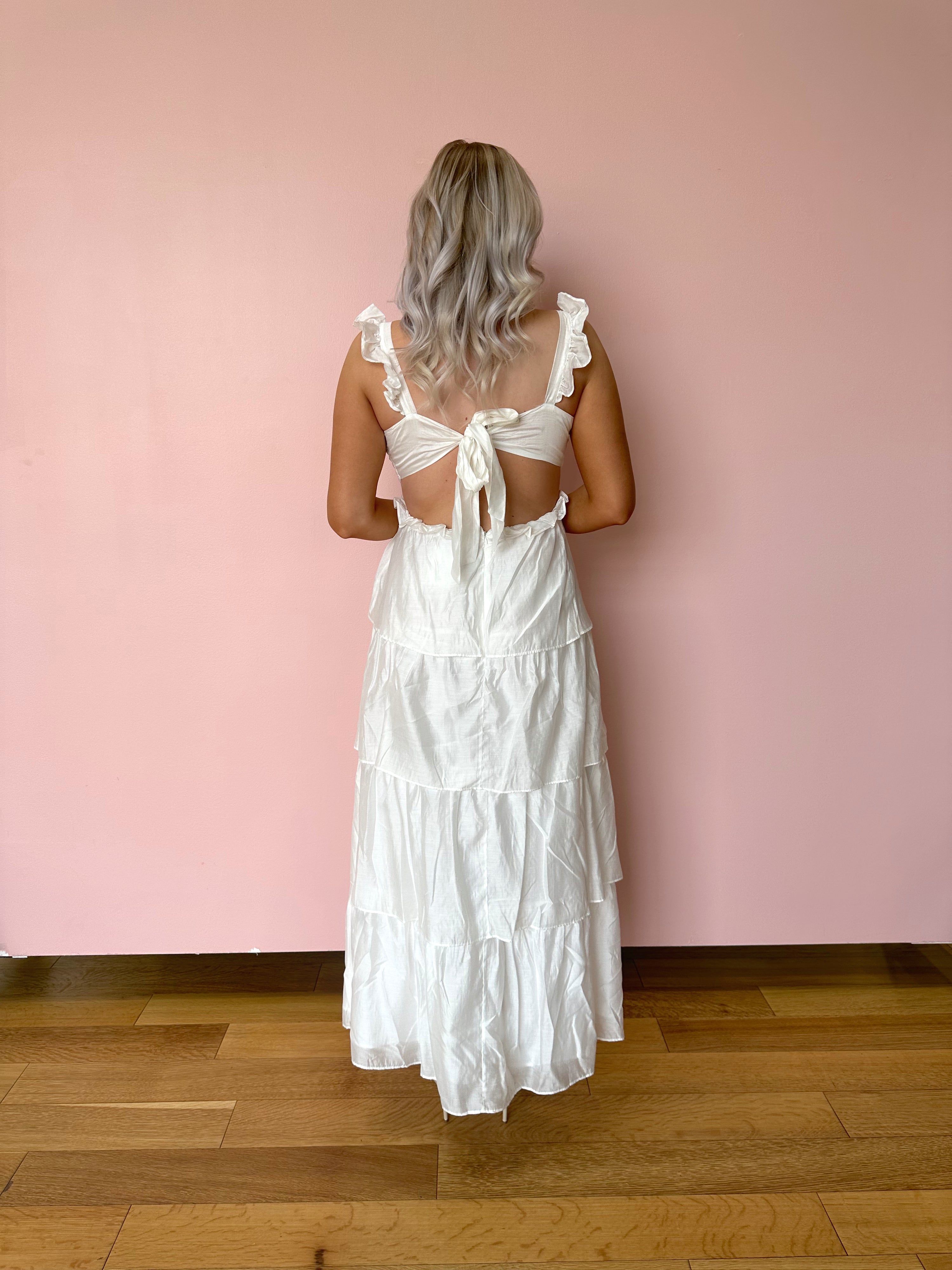 White tiered maxi dress with rosette detail. Great for brides. 