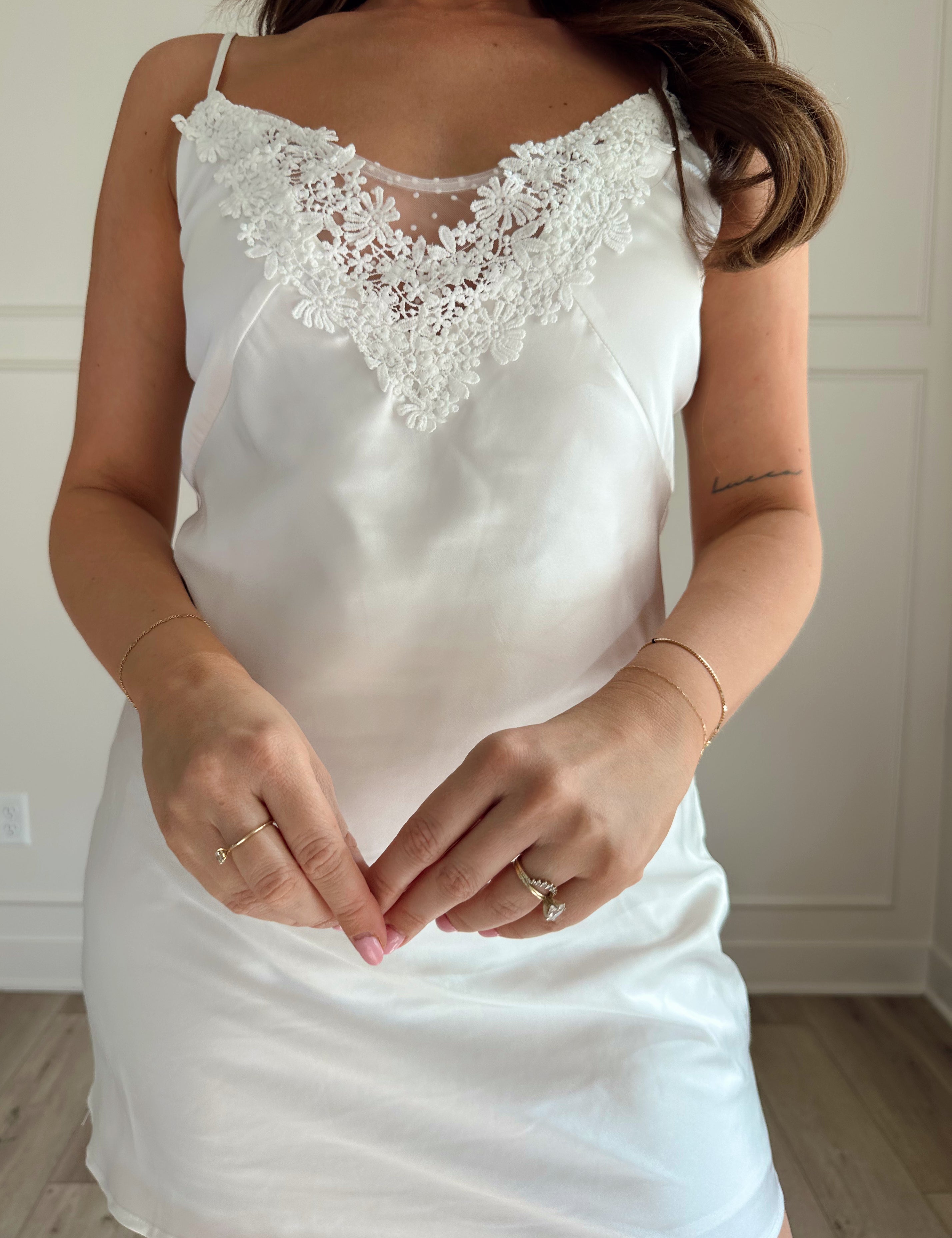 White satin slip dress with lace neckline 