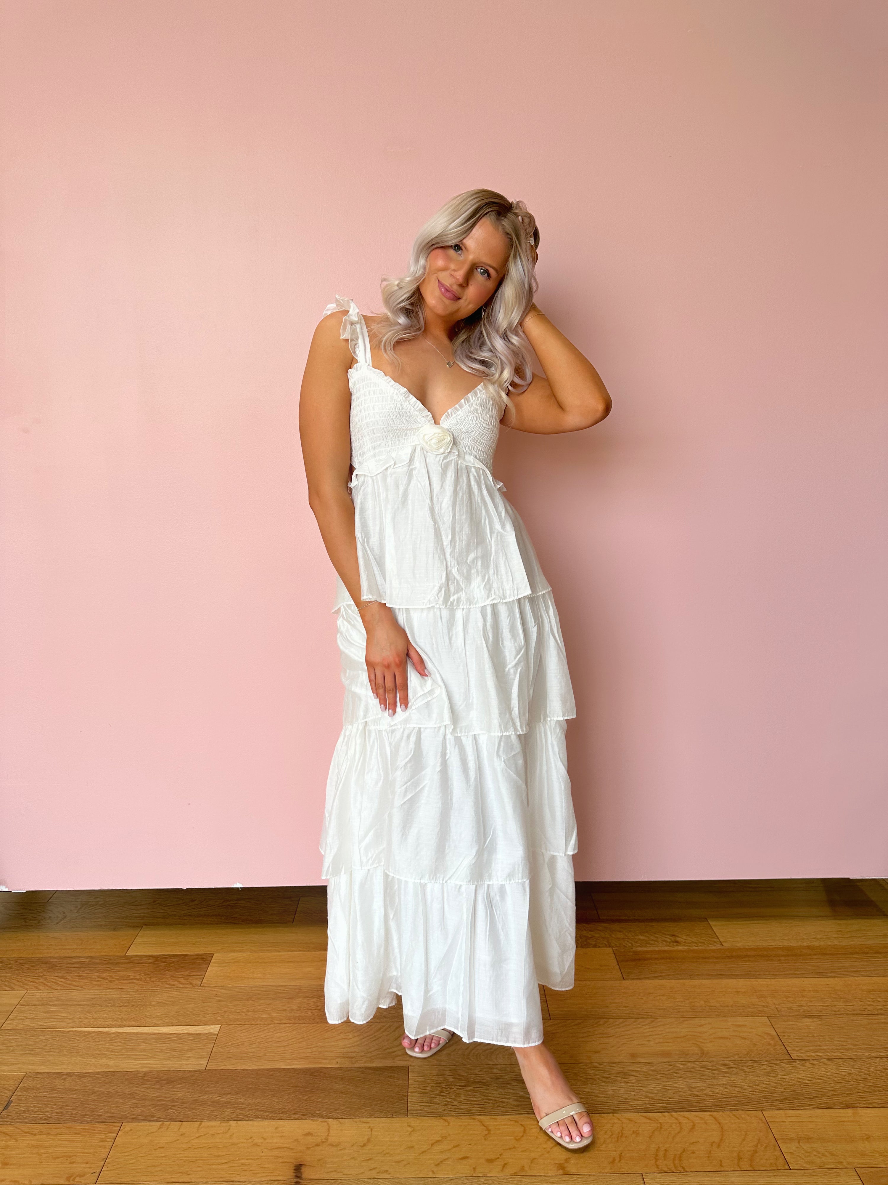 White tiered maxi dress with rosette detail. Great for brides. 