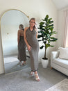 Tan and black chevron knit maxi dress with self tie halter neckline. 