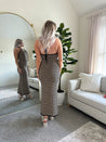 Tan and black chevron knit maxi dress with self tie halter neckline. 