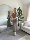 Tan and black chevron knit maxi dress with self tie halter neckline. 