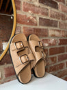 Brown flat sandal with good hardware buckle. Perfect for everyday wear.