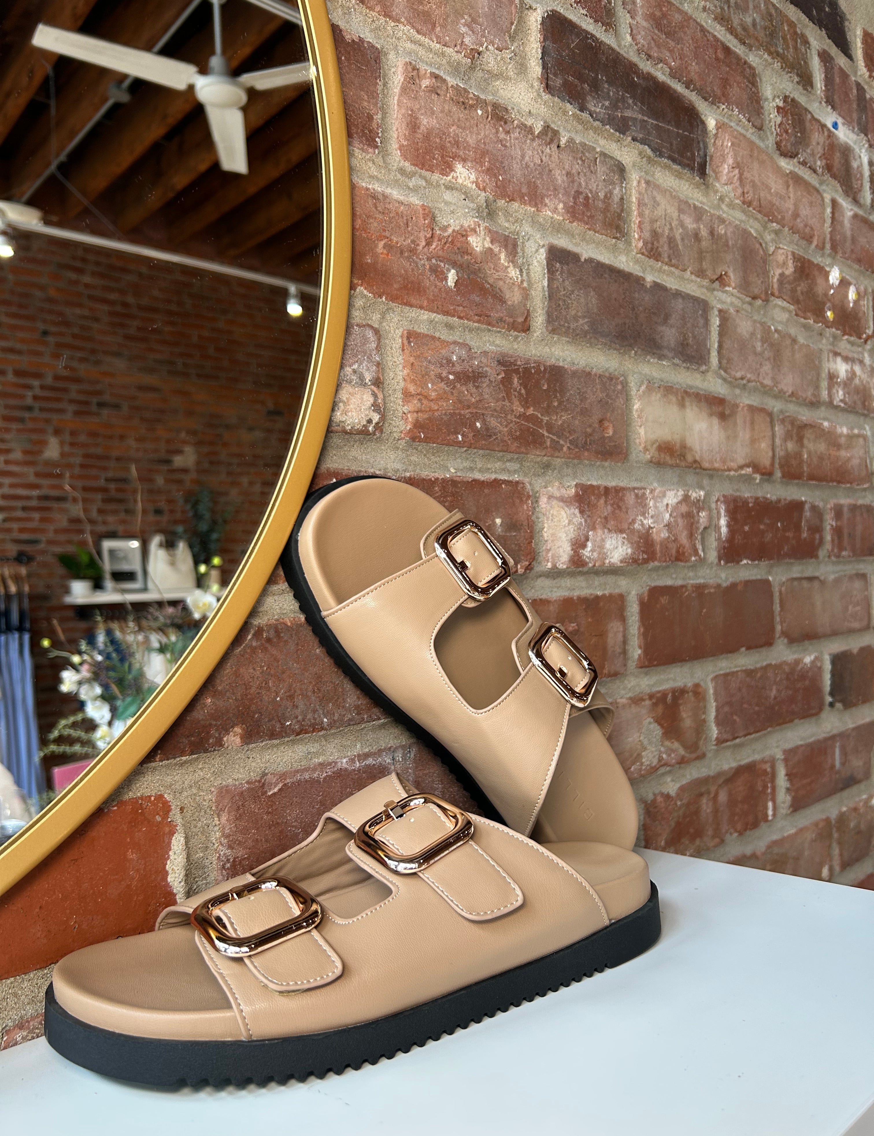 Brown flat sandal with good hardware buckle. Perfect for everyday wear.