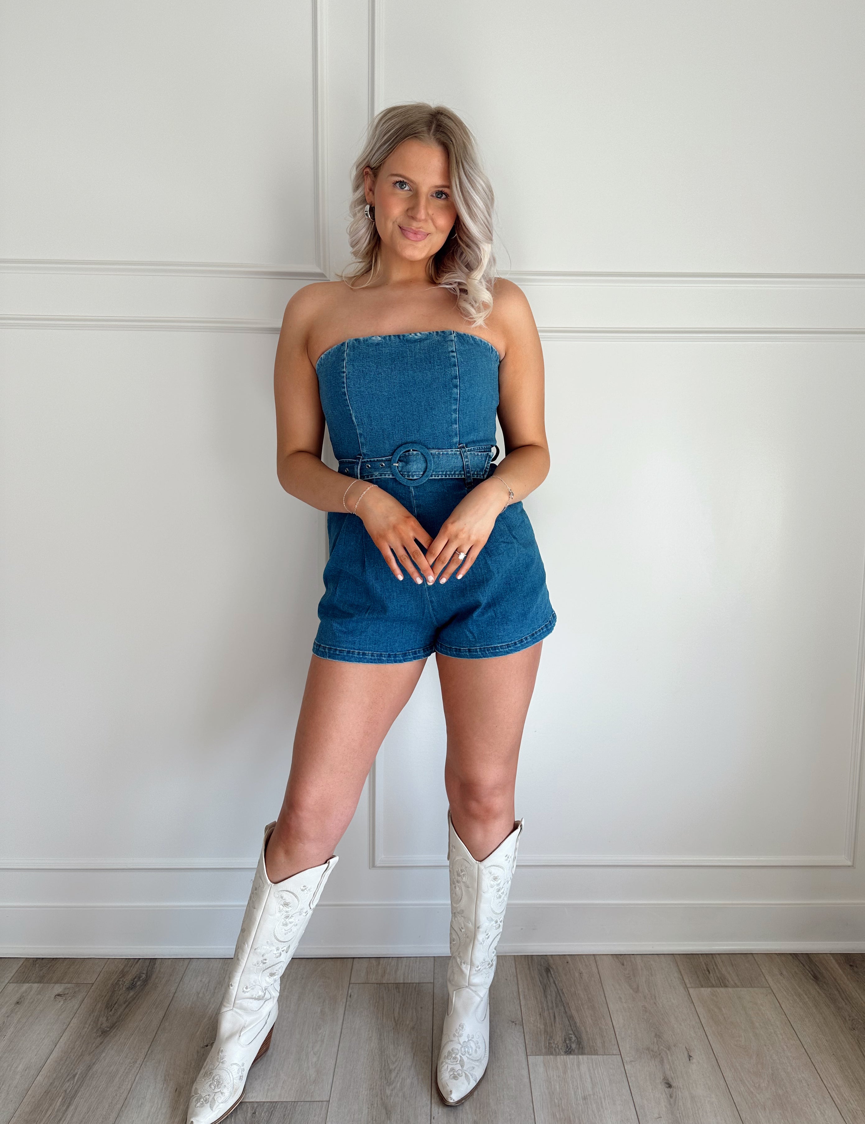 Dark wash strapless denim romper with belted waist