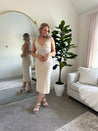 Light tan knit midi dress with open tie back. 