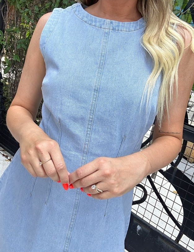 Della sleeveless light wash denim mini dress with seams