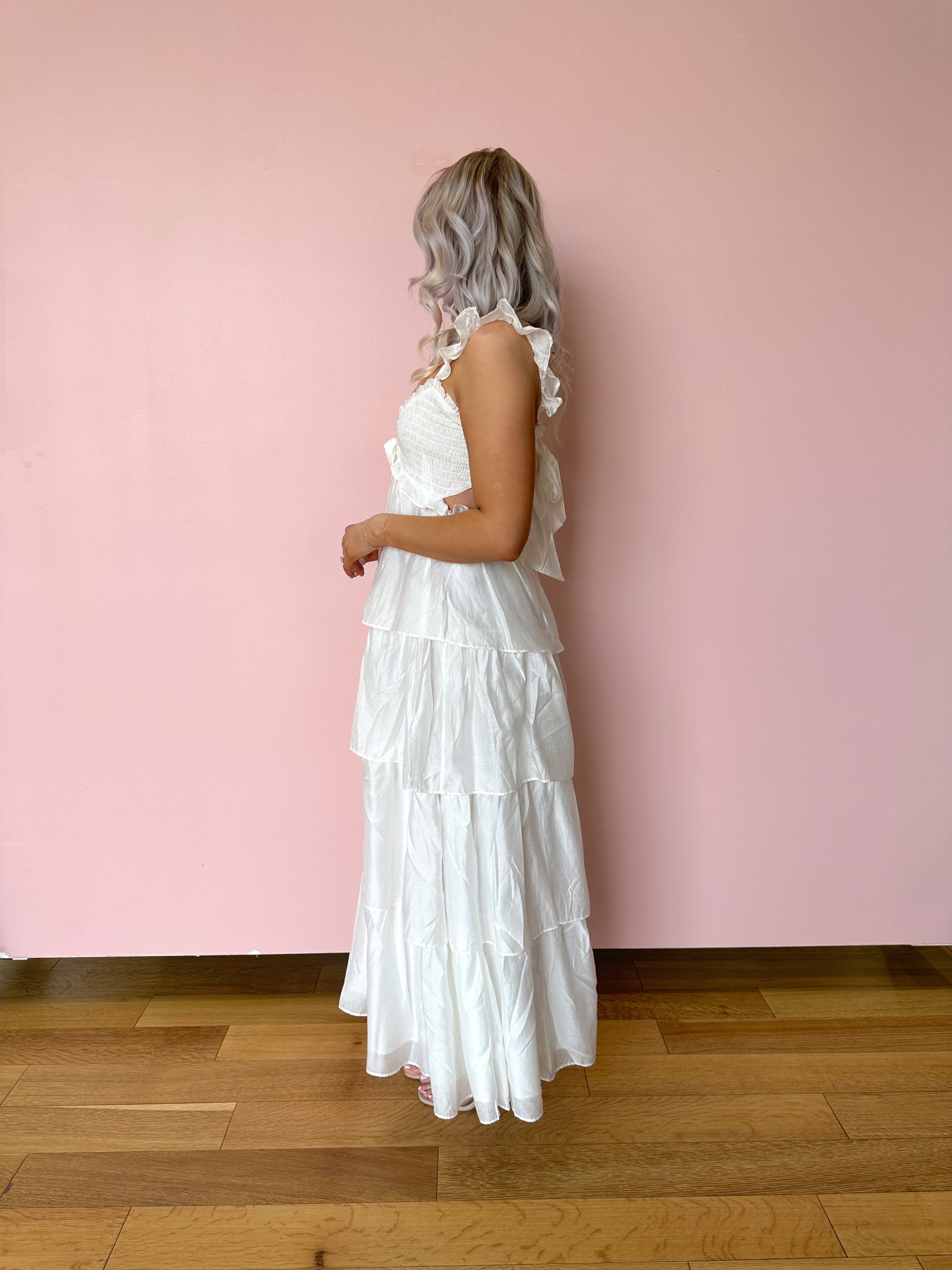 White tiered maxi dress with rosette detail. Great for brides. 