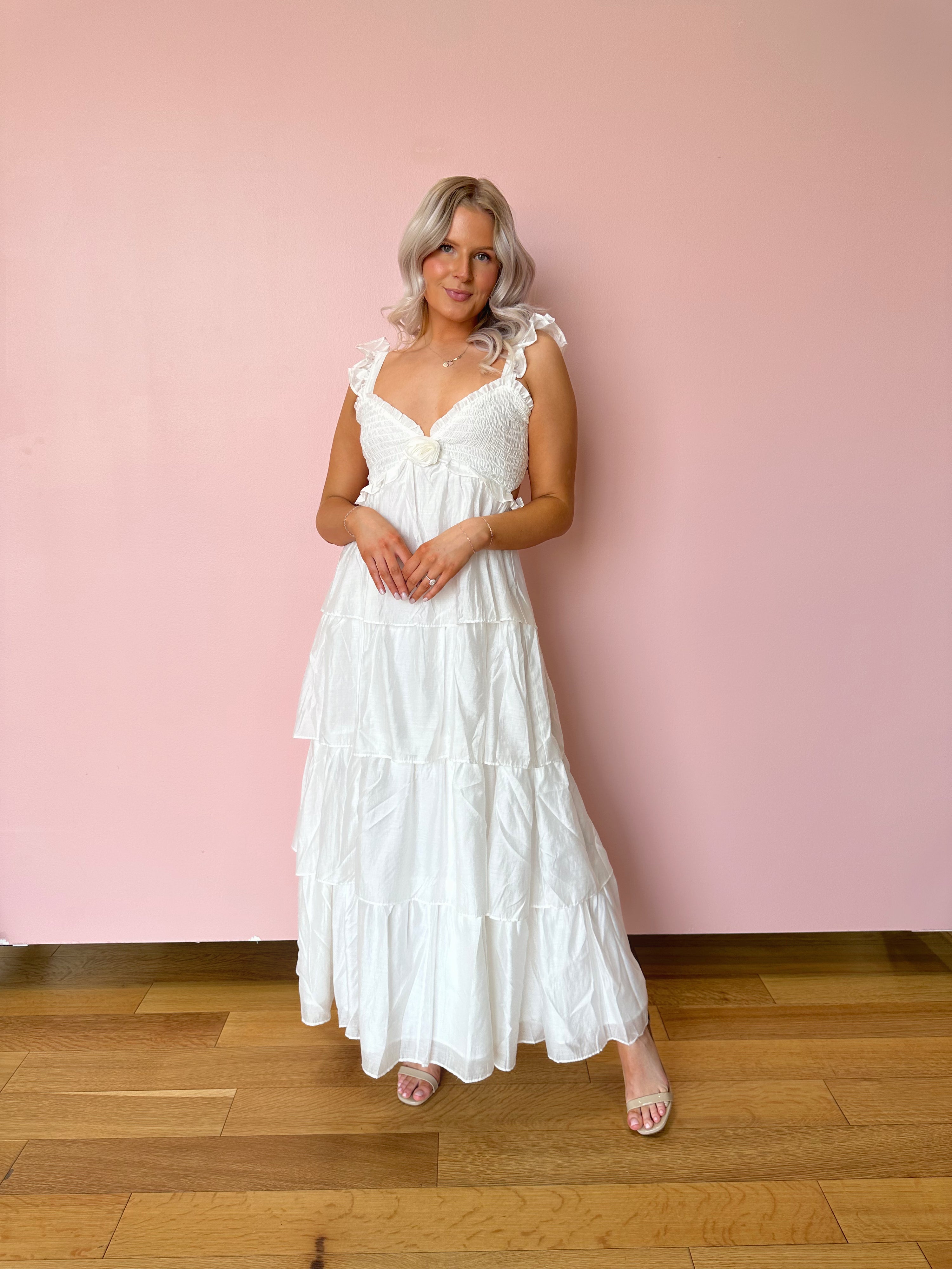 White tiered maxi dress with rosette detail. Great for brides. 