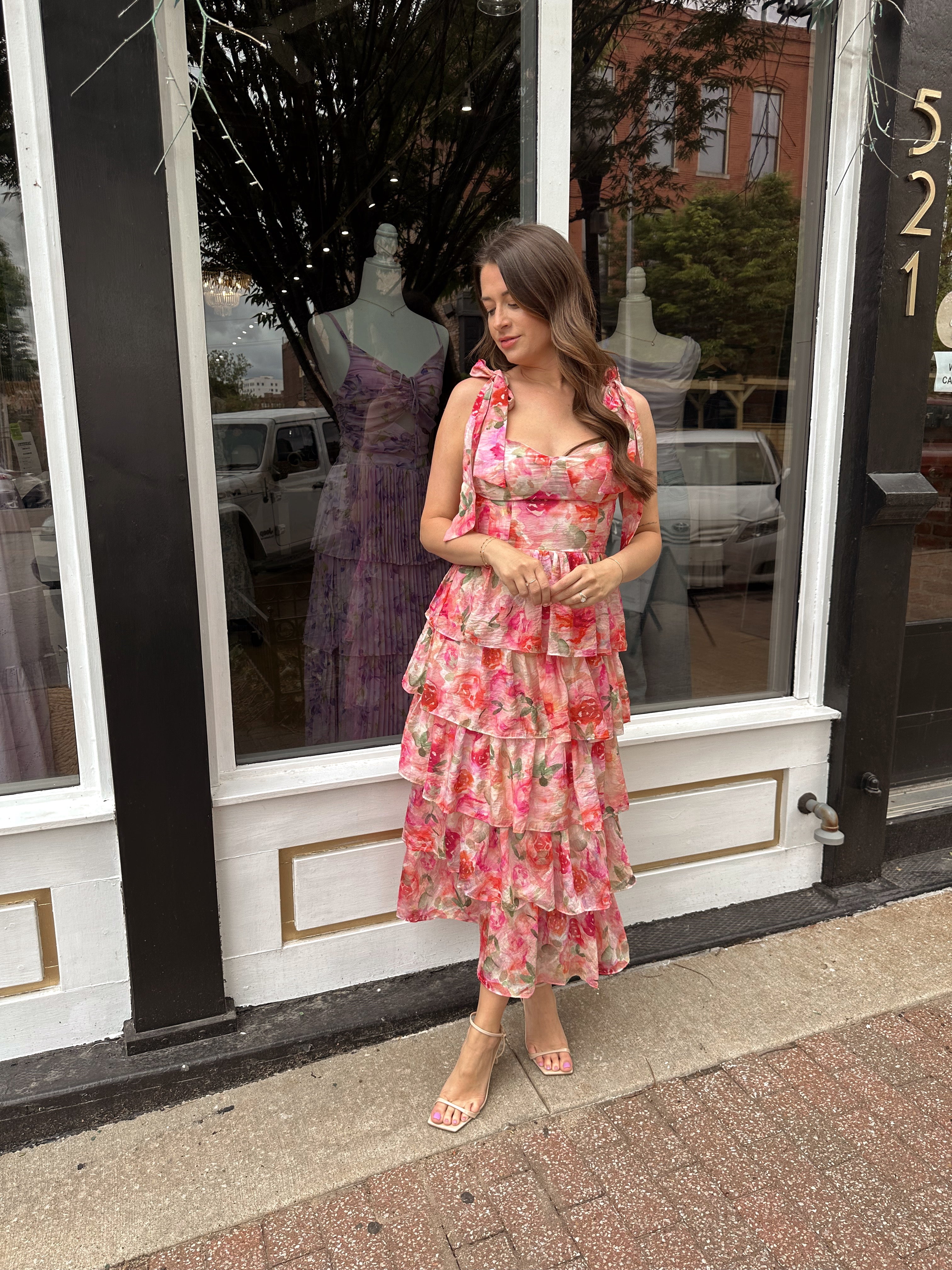 Pink floral tiered midi dress with ruffle layers and tie shoulder straps