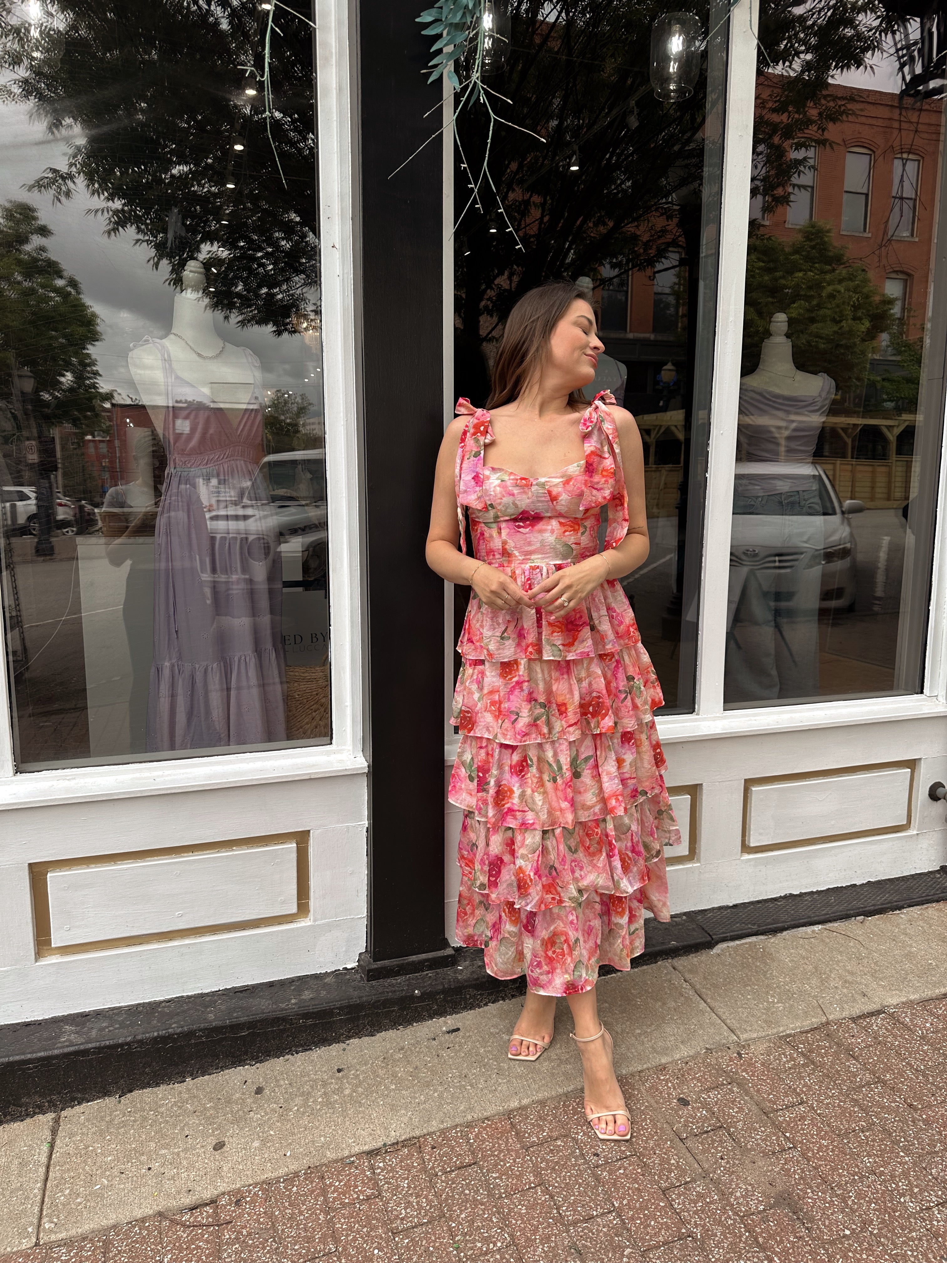 Pink floral tiered midi dress with ruffle layers and tie shoulder straps