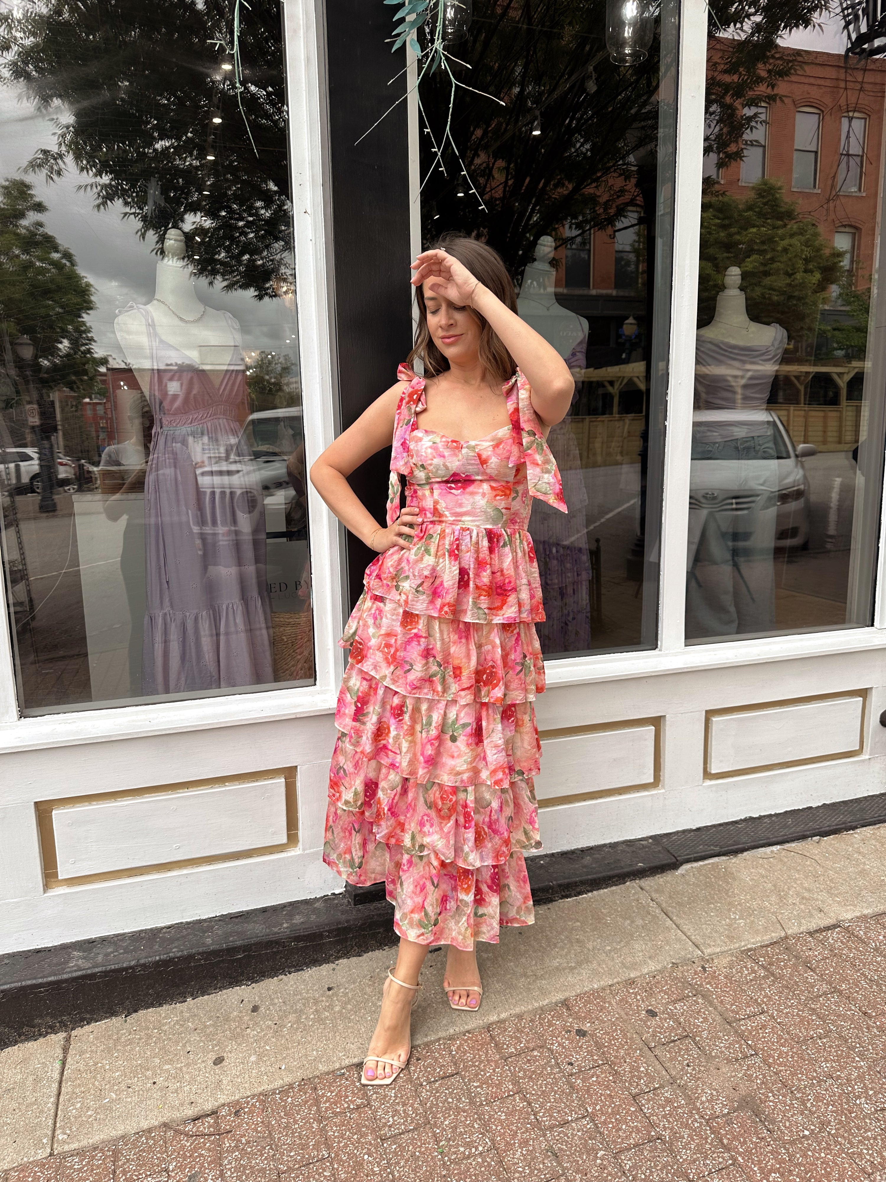 Pink floral tiered midi dress with ruffle layers and tie shoulder straps