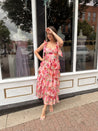 Pink floral tiered midi dress with ruffle layers and tie shoulder straps