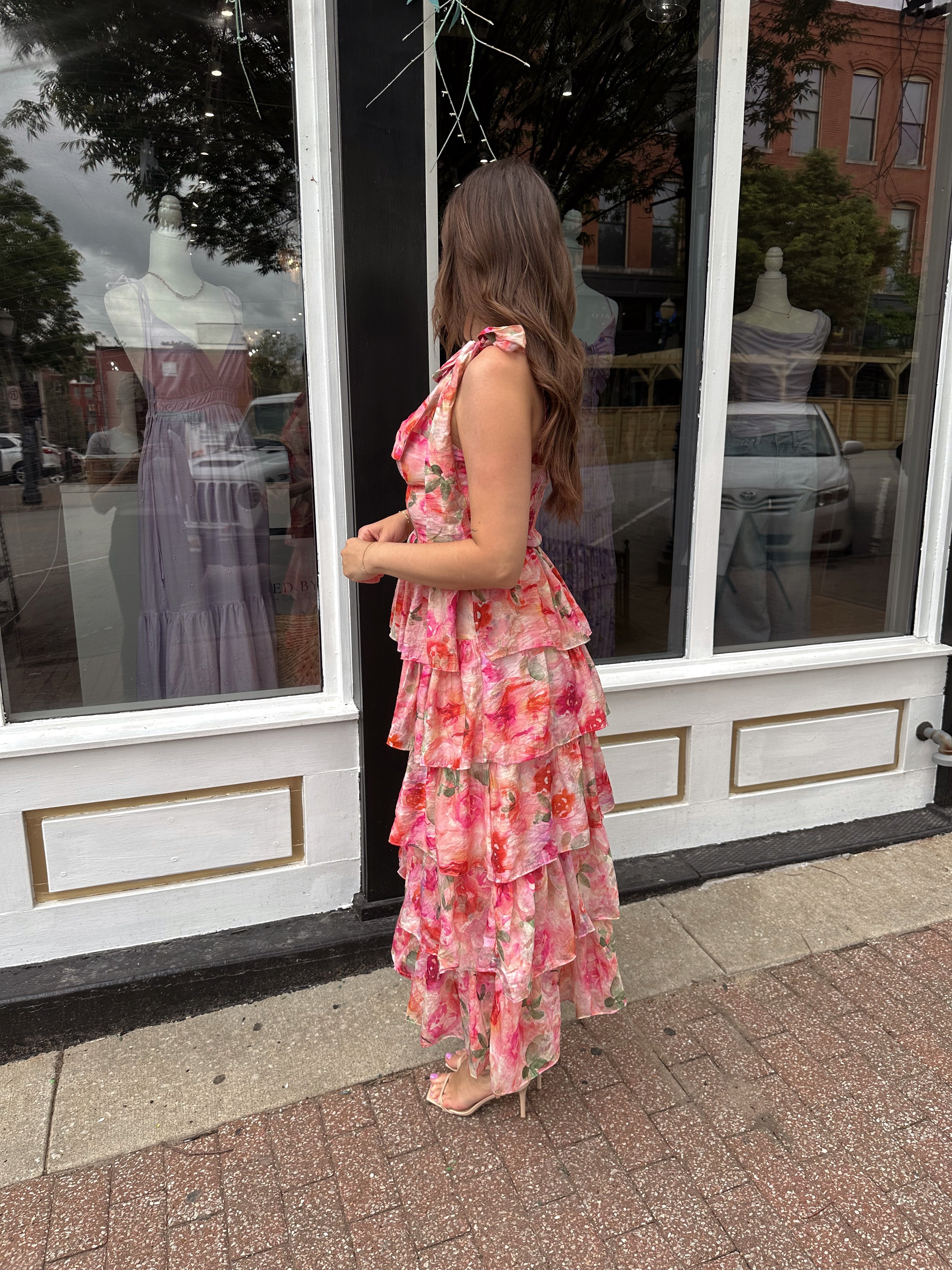 Pink floral tiered midi dress with ruffle layers and tie shoulder straps