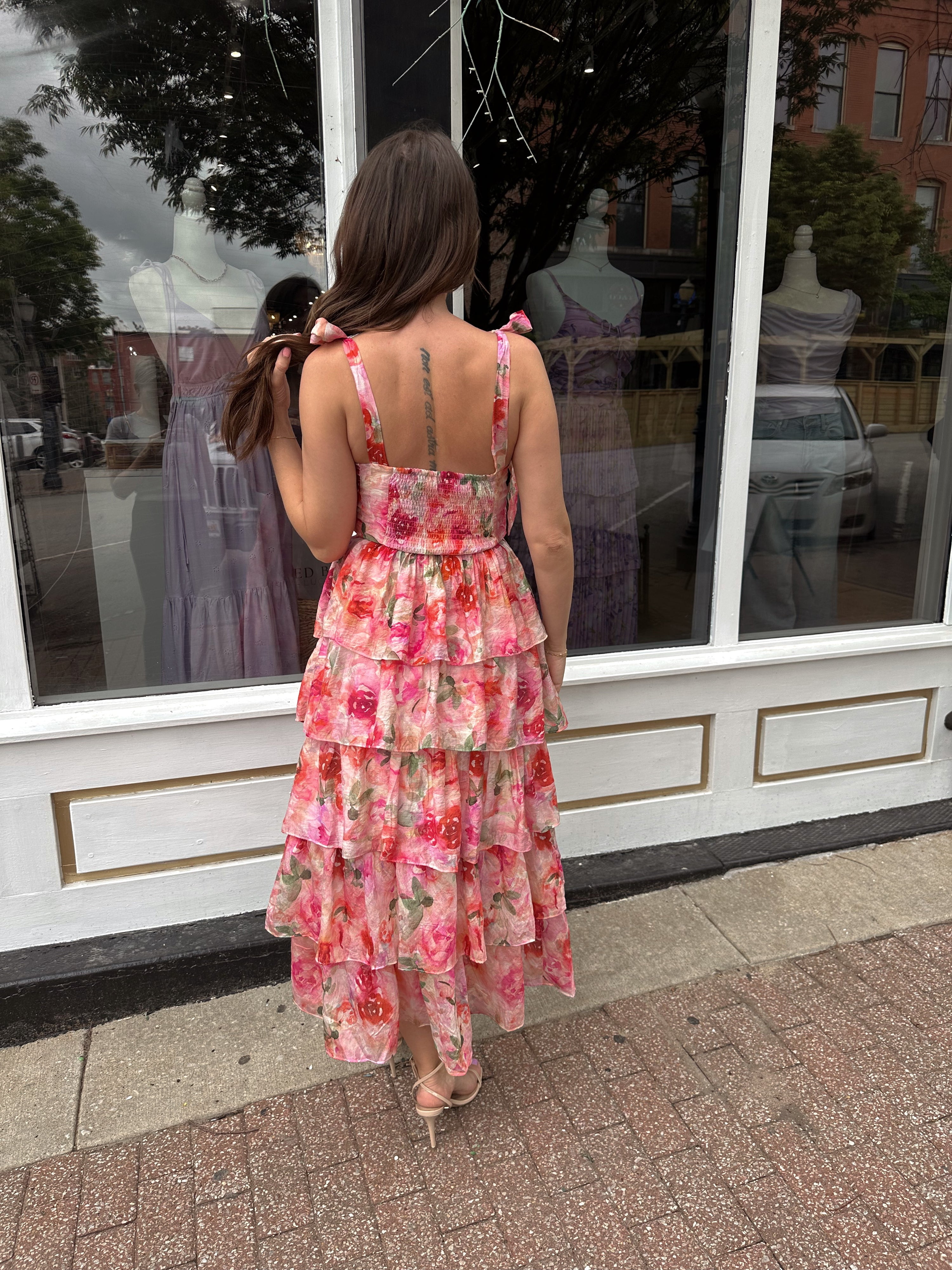 Pink floral tiered midi dress with ruffle layers and tie shoulder straps