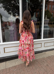 Pink floral tiered midi dress with ruffle layers and tie shoulder straps