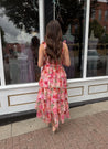 Pink floral tiered midi dress with ruffle layers and tie shoulder straps