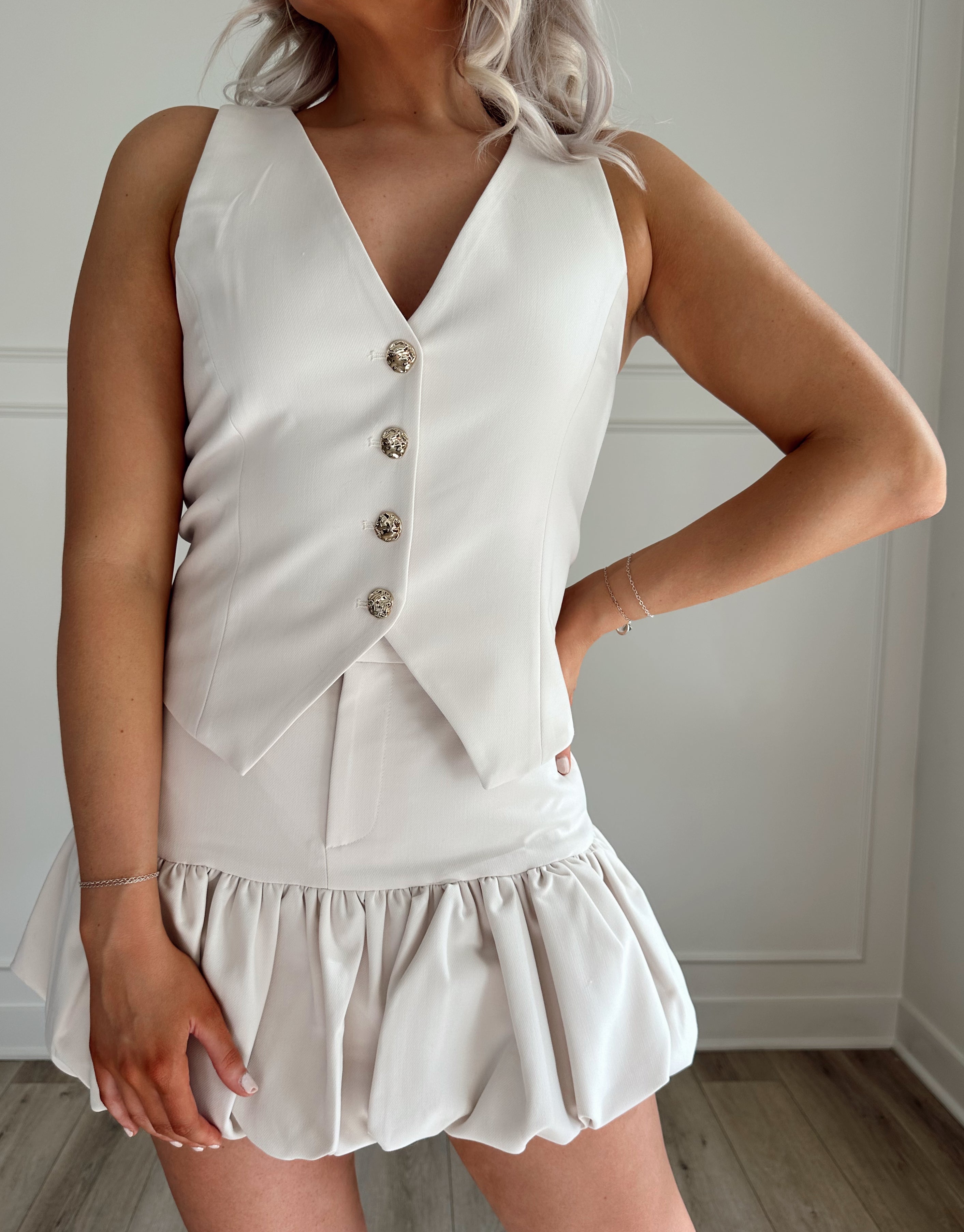 Cream ruffle hem mini skirt. Perfect for dressing up or down. 