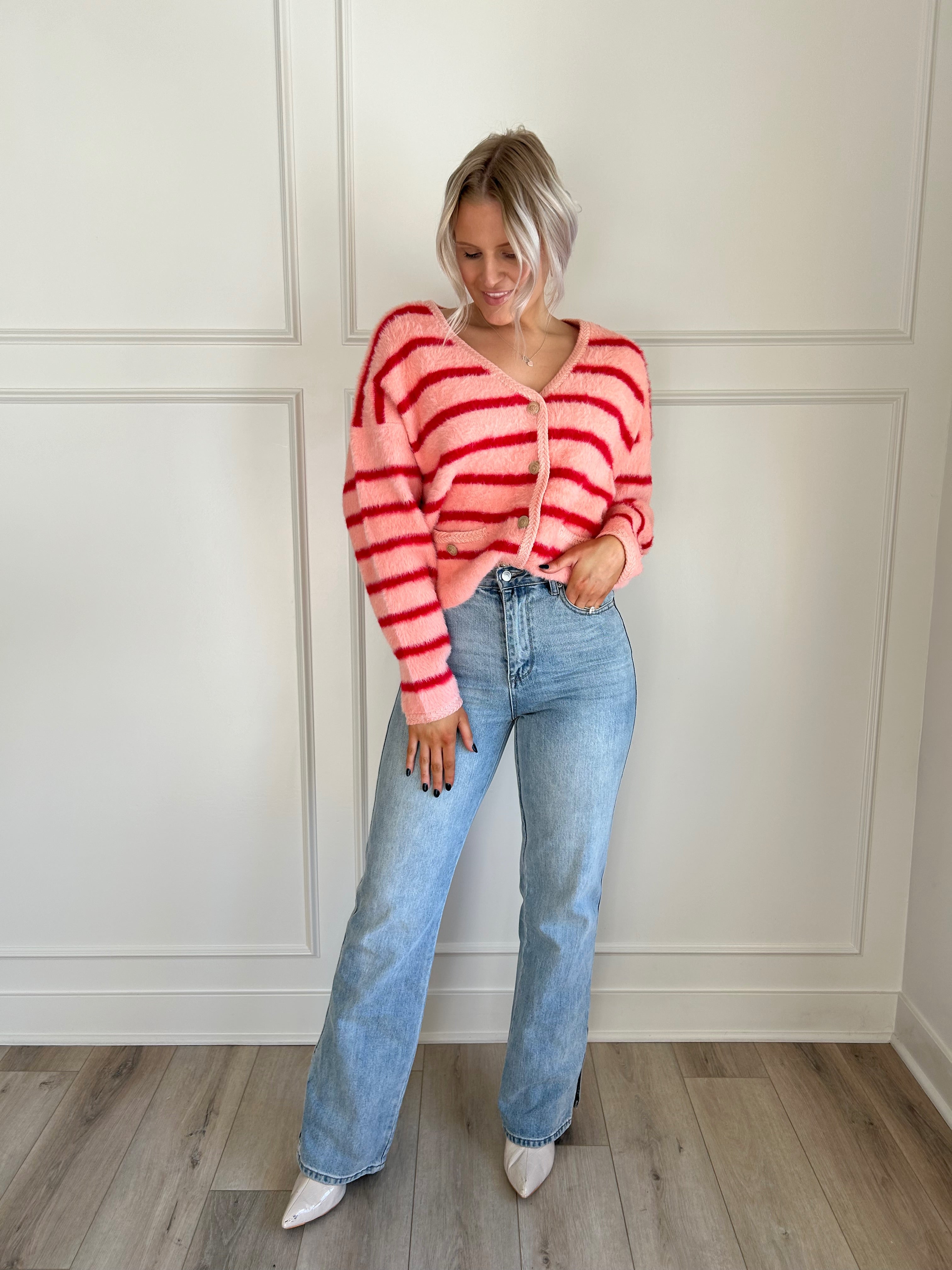 Pink and red striped fuzzy cardigan with button-up front and cozy fit.