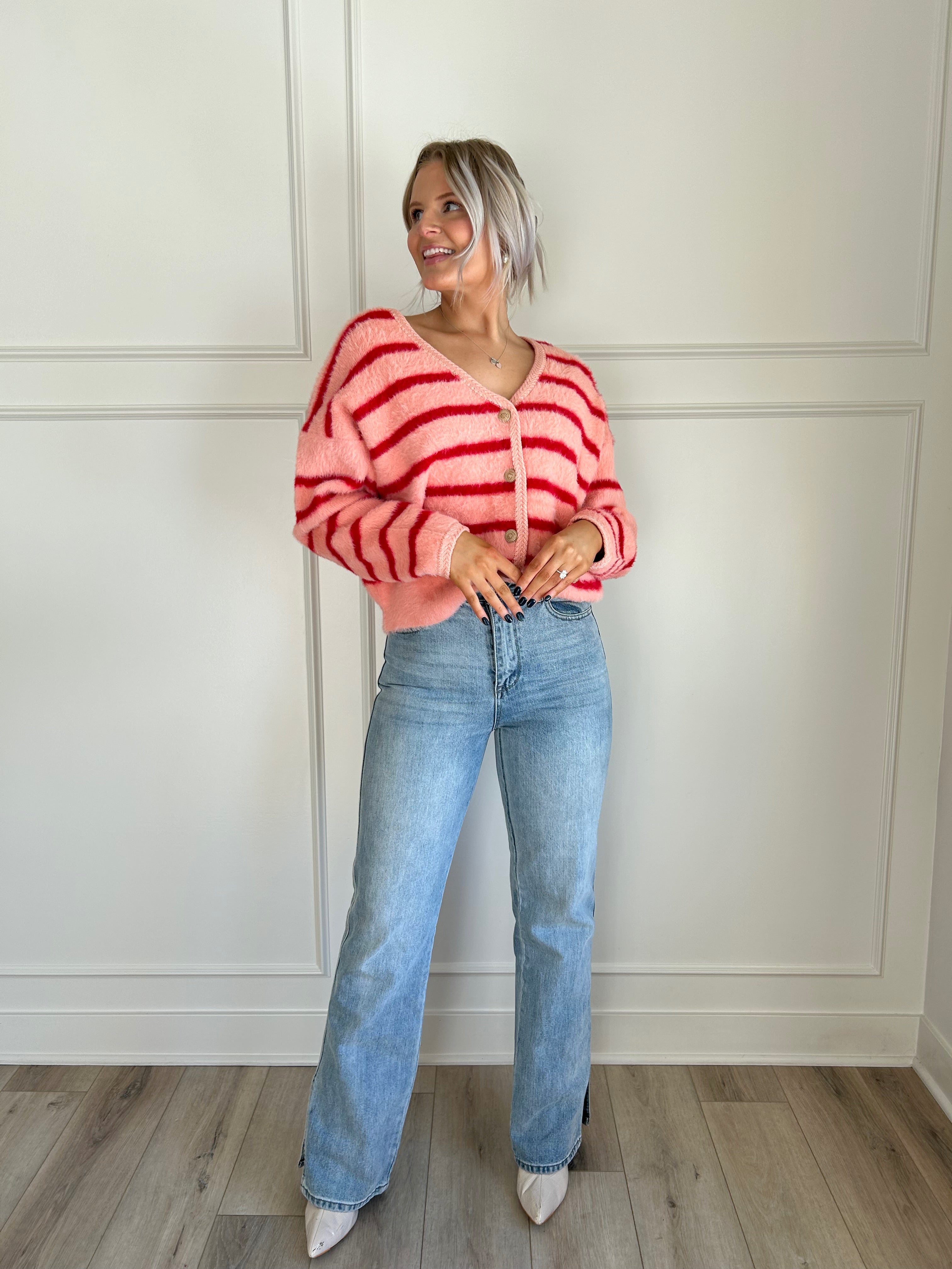 Pink and red striped fuzzy cardigan with button-up front and cozy fit.