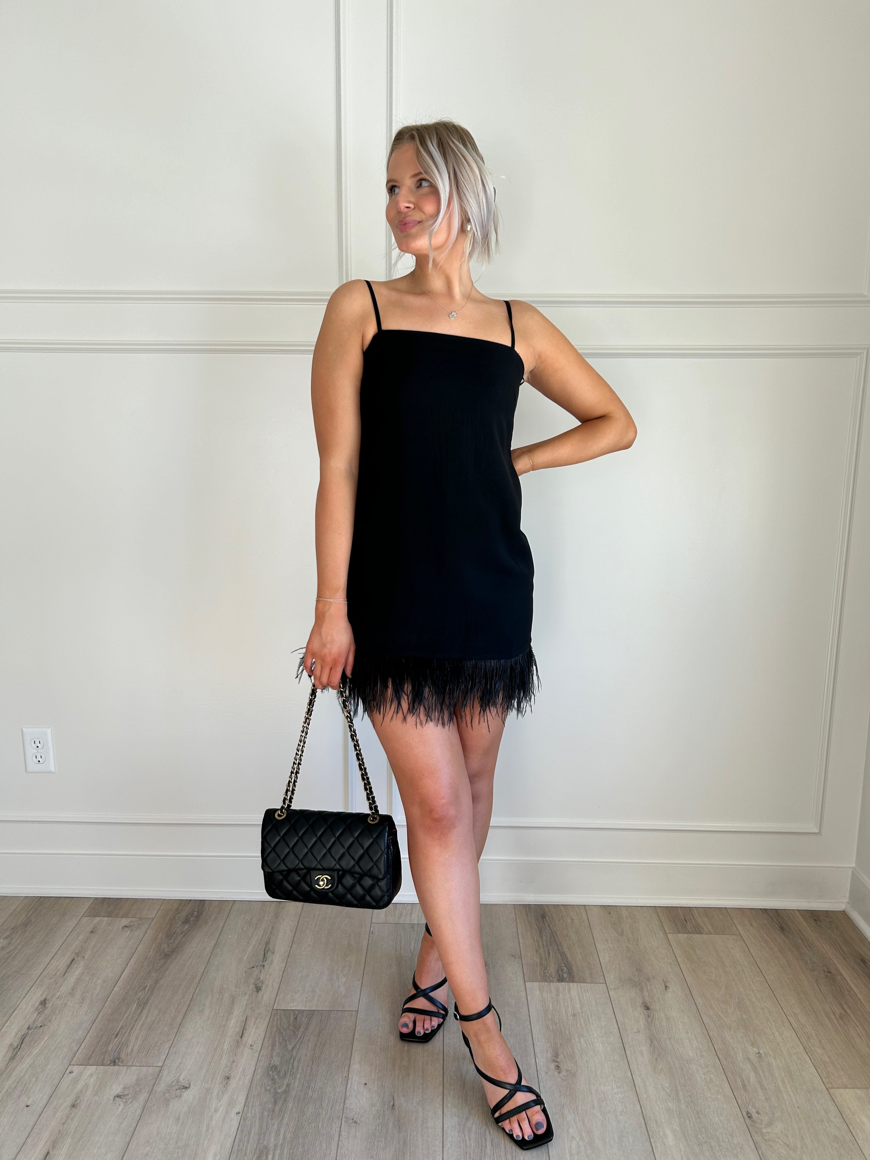 Black feather hem dress.