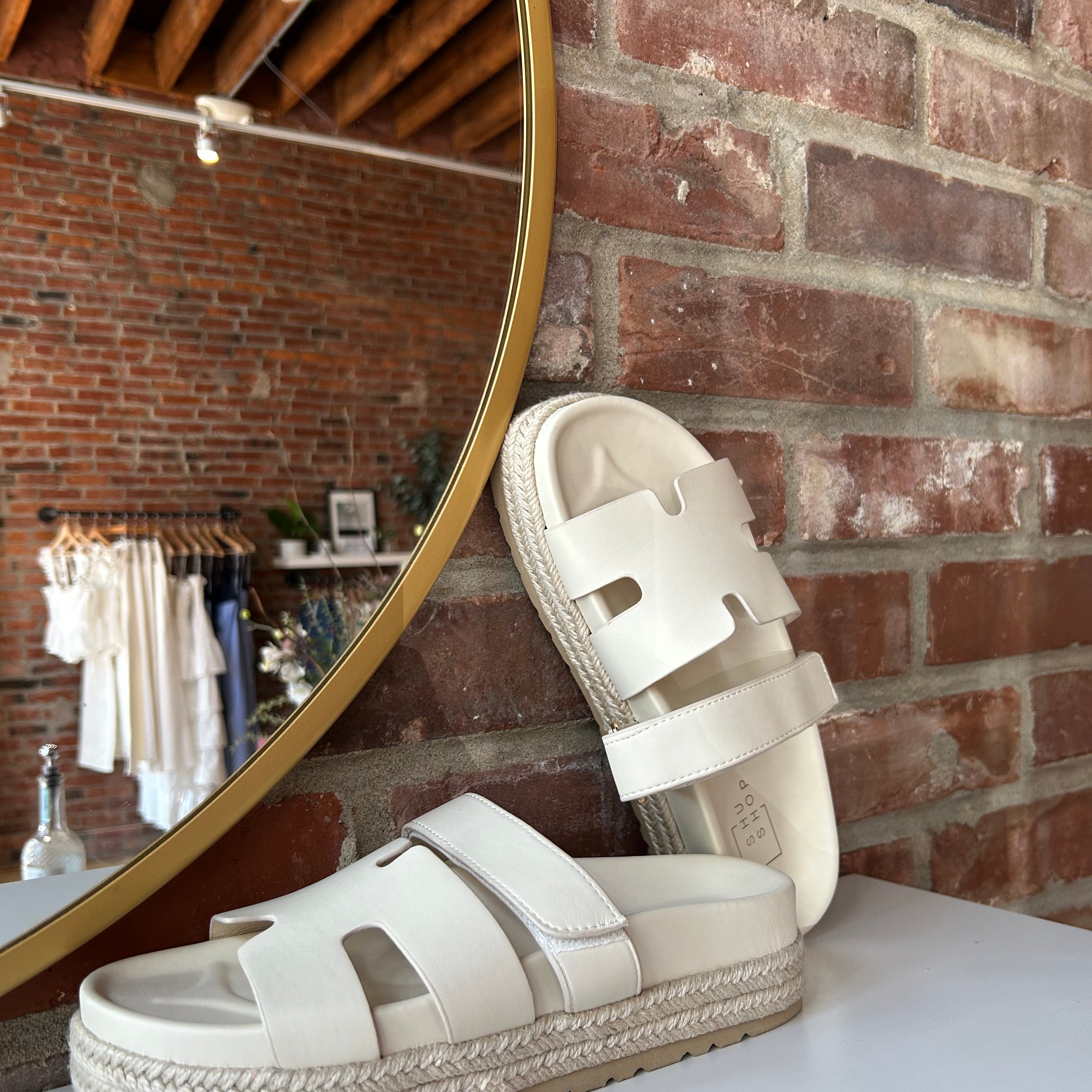 Cream platform espadrille sandal with cutout straps and a velcro band