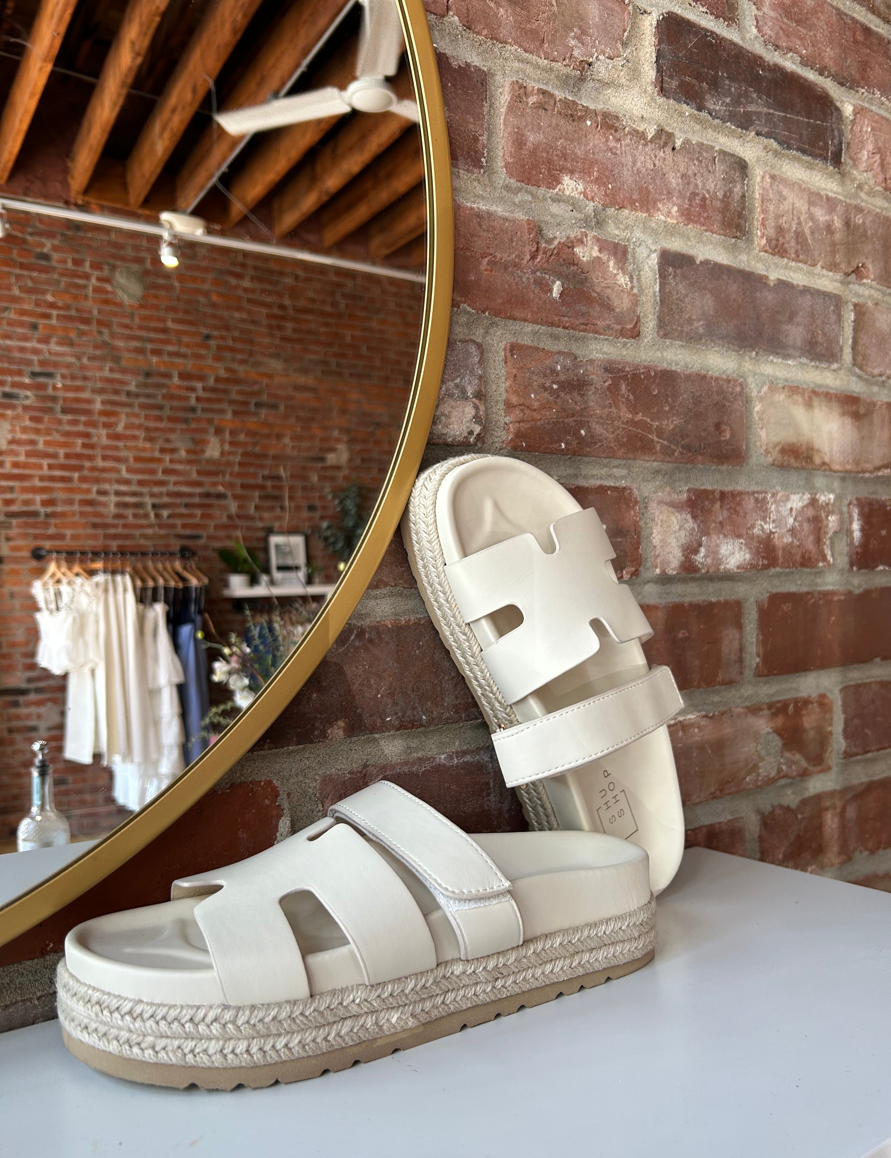 Cream platform espadrille sandal with cutout straps and a velcro band