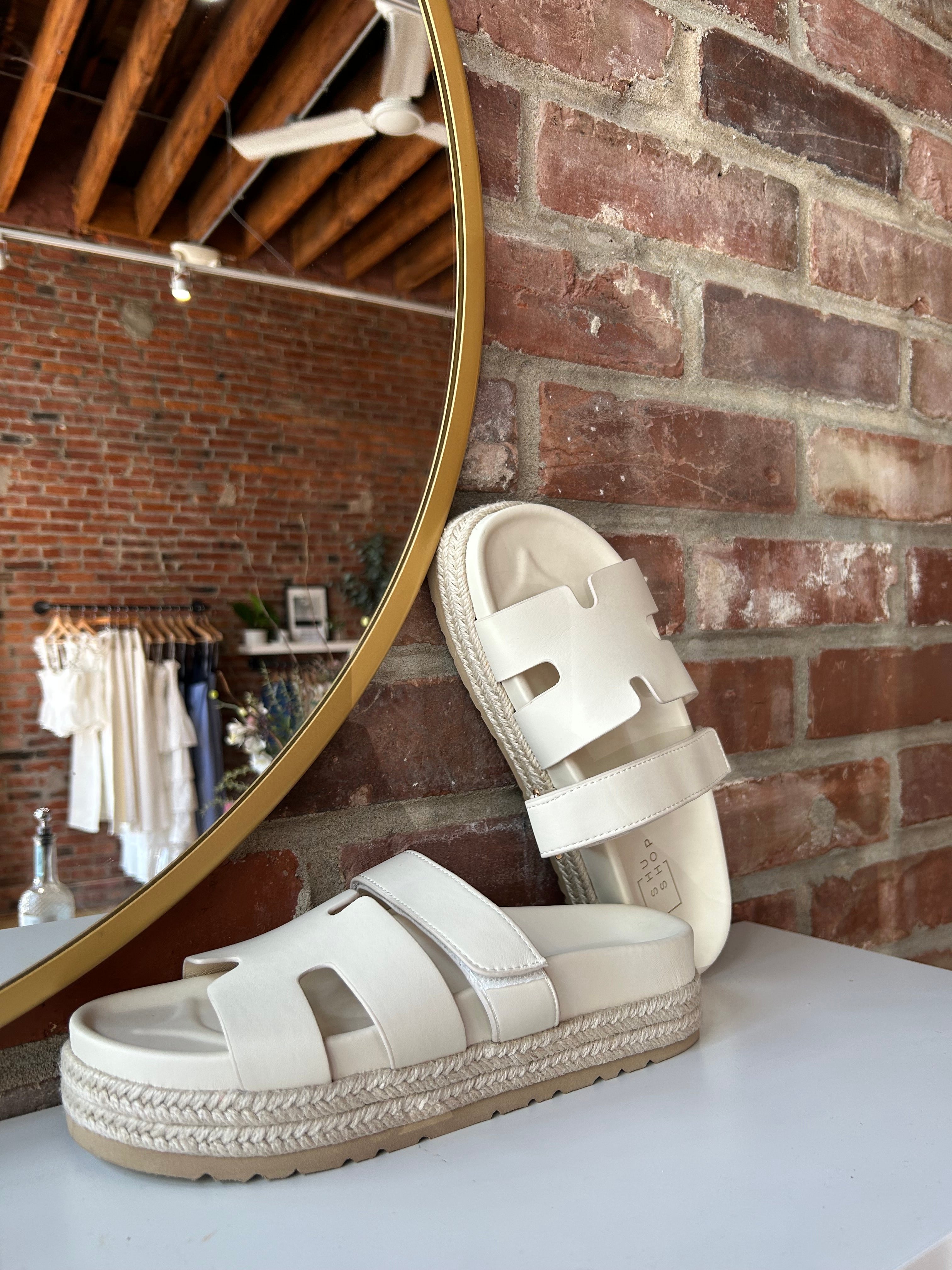 Cream platform espadrille sandal with cutout straps and a velcro band