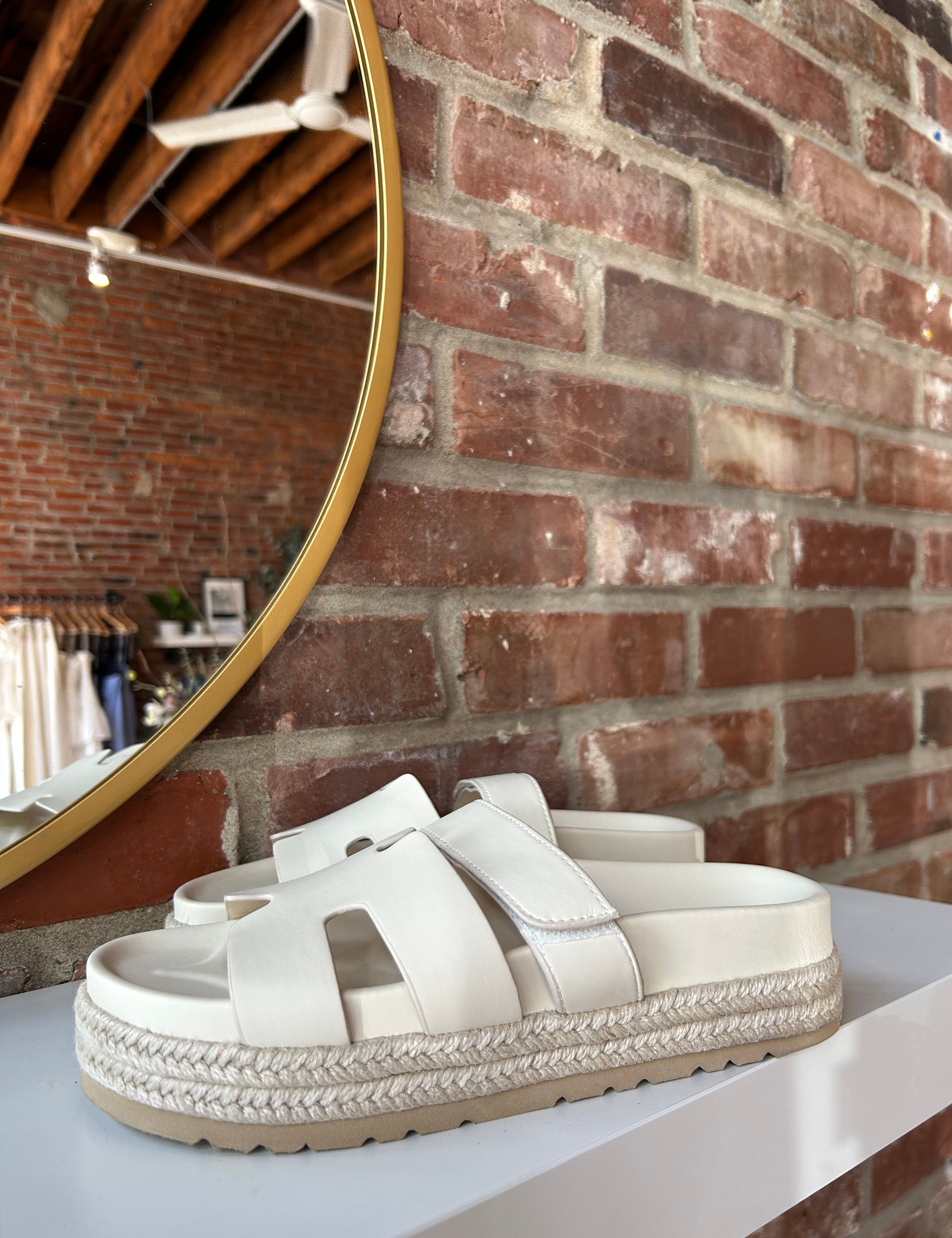 Cream platform espadrille sandal with cutout straps and a velcro band