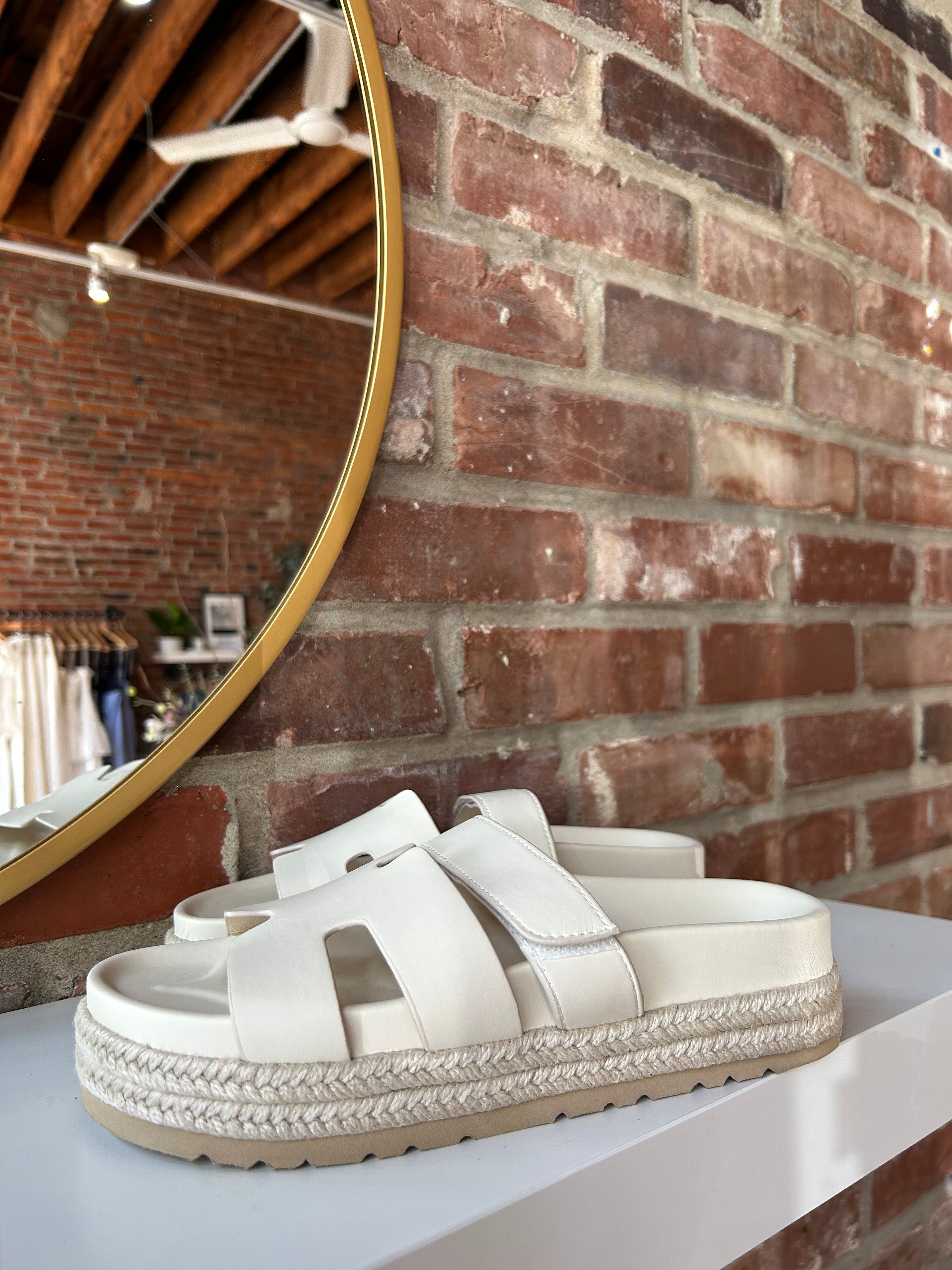 Cream platform espadrille sandal with cutout straps and a velcro band