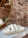 Cream platform espadrille sandal with cutout straps and a velcro band