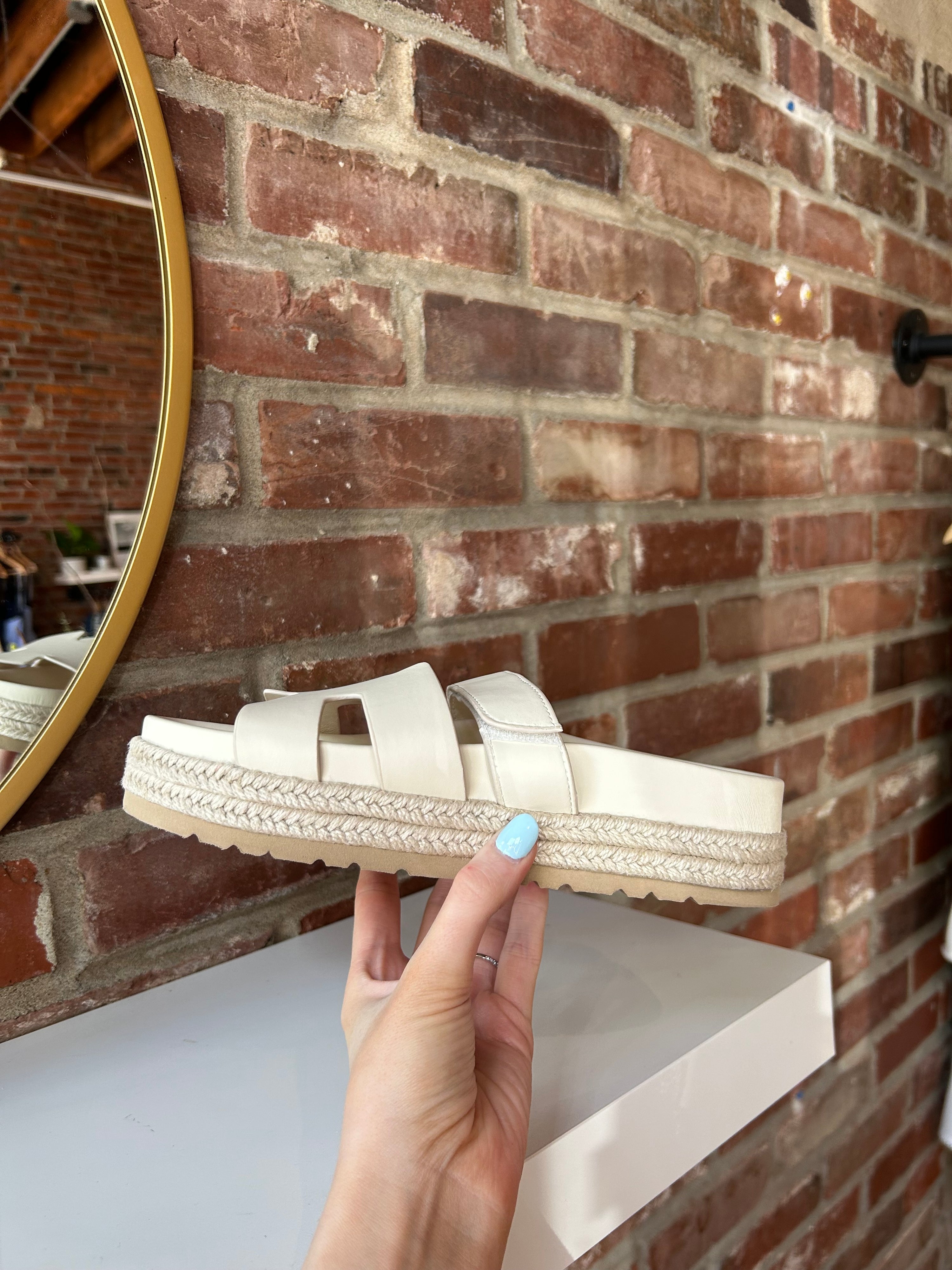 Cream platform espadrille sandal with cutout straps and a velcro band