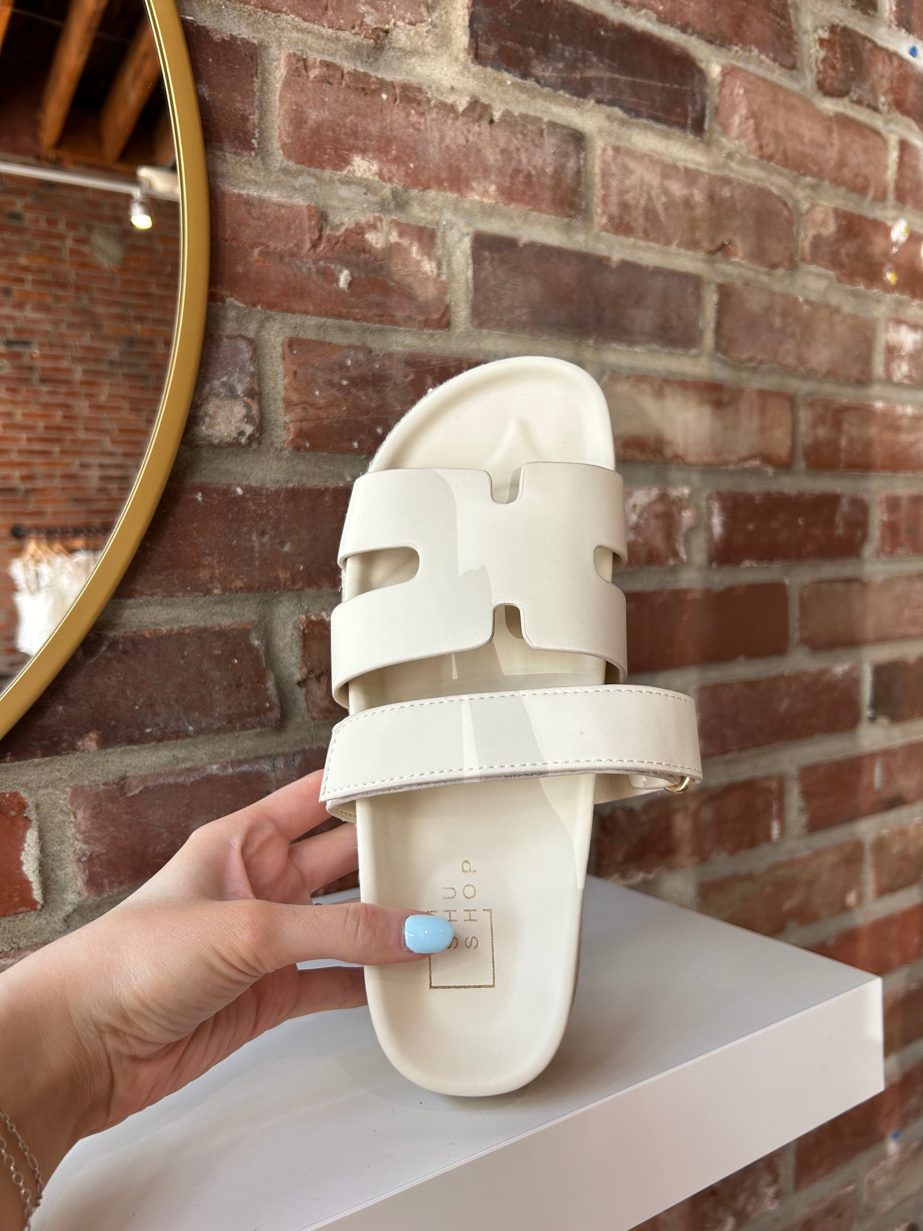 Cream platform espadrille sandal with cutout straps and a velcro band