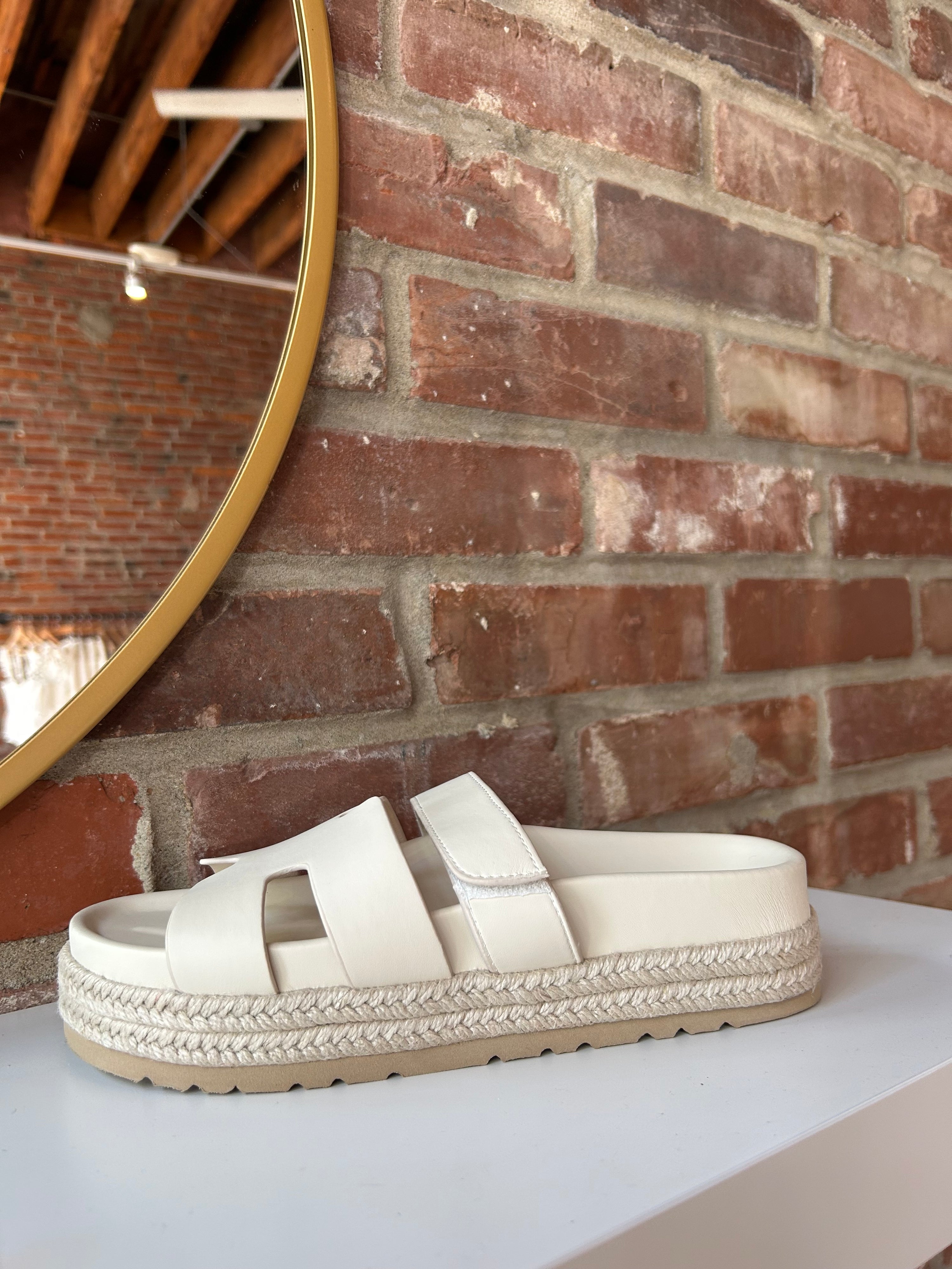 Cream platform espadrille sandal with cutout straps and a velcro band