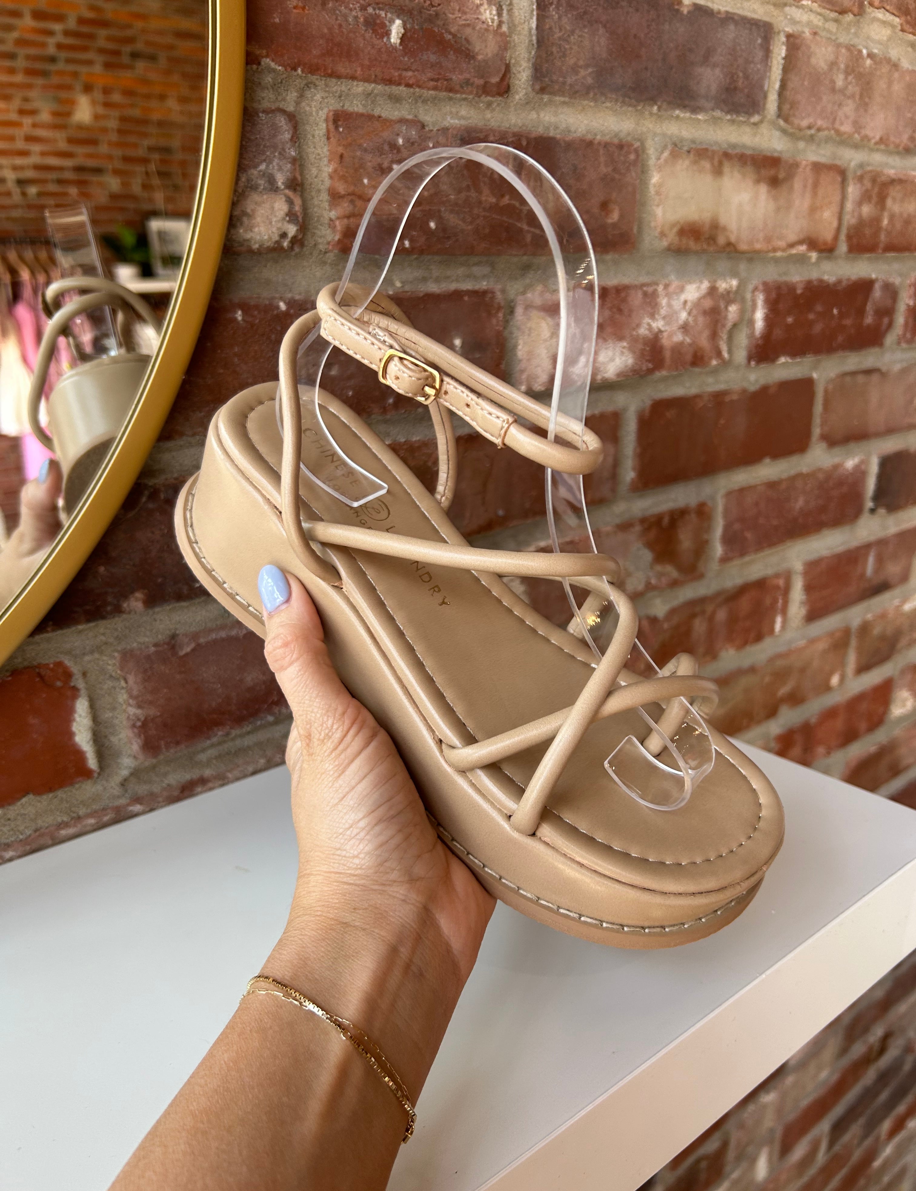 Taylor Strappy Platform Sandals with crisscross straps, an ankle buckle, and a cushioned platform sole for a trendy, comfortable fit