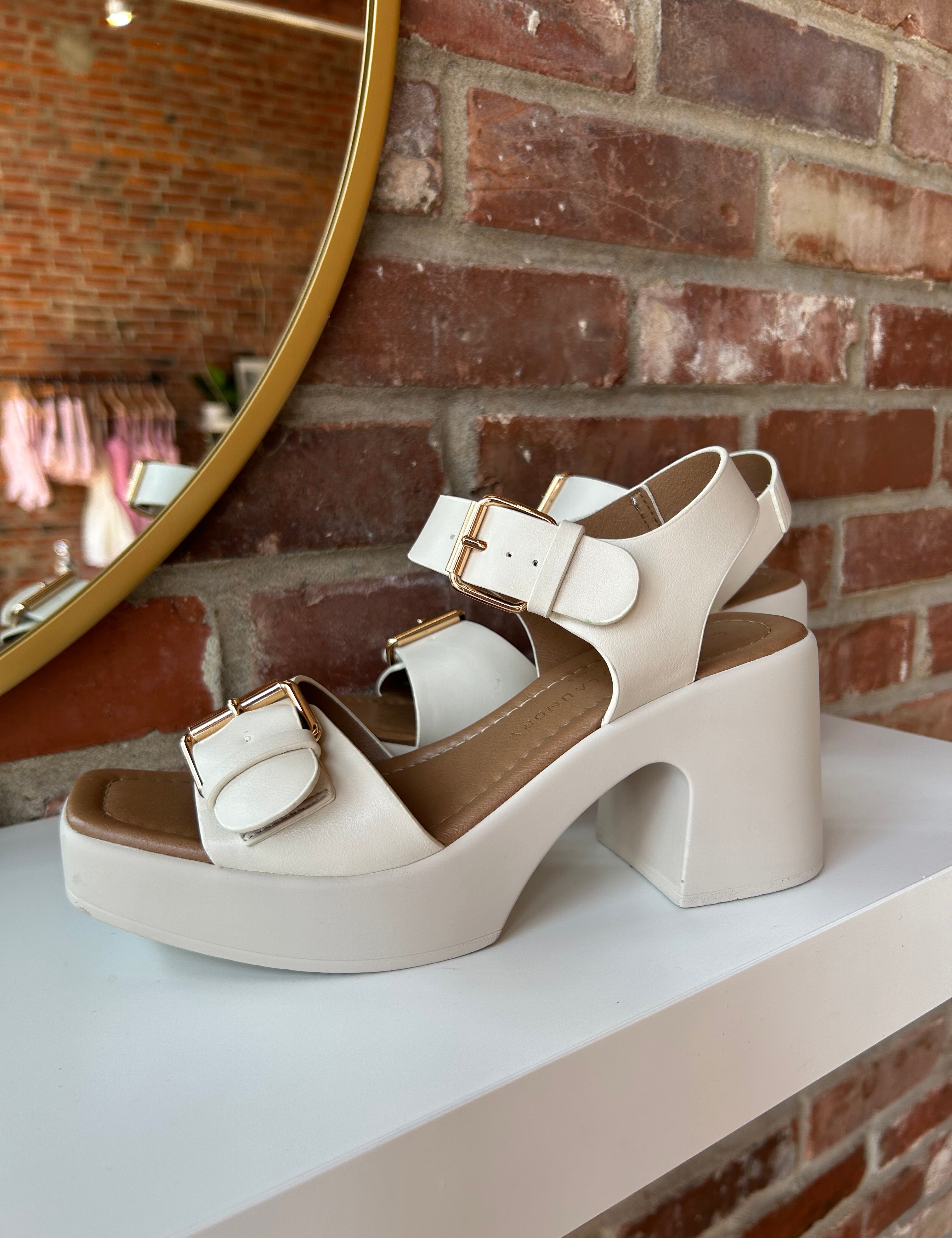 Polly Platform Heel with chunky block heels, gold buckles, and an adjustable strap for a stylish and comfortable look.
