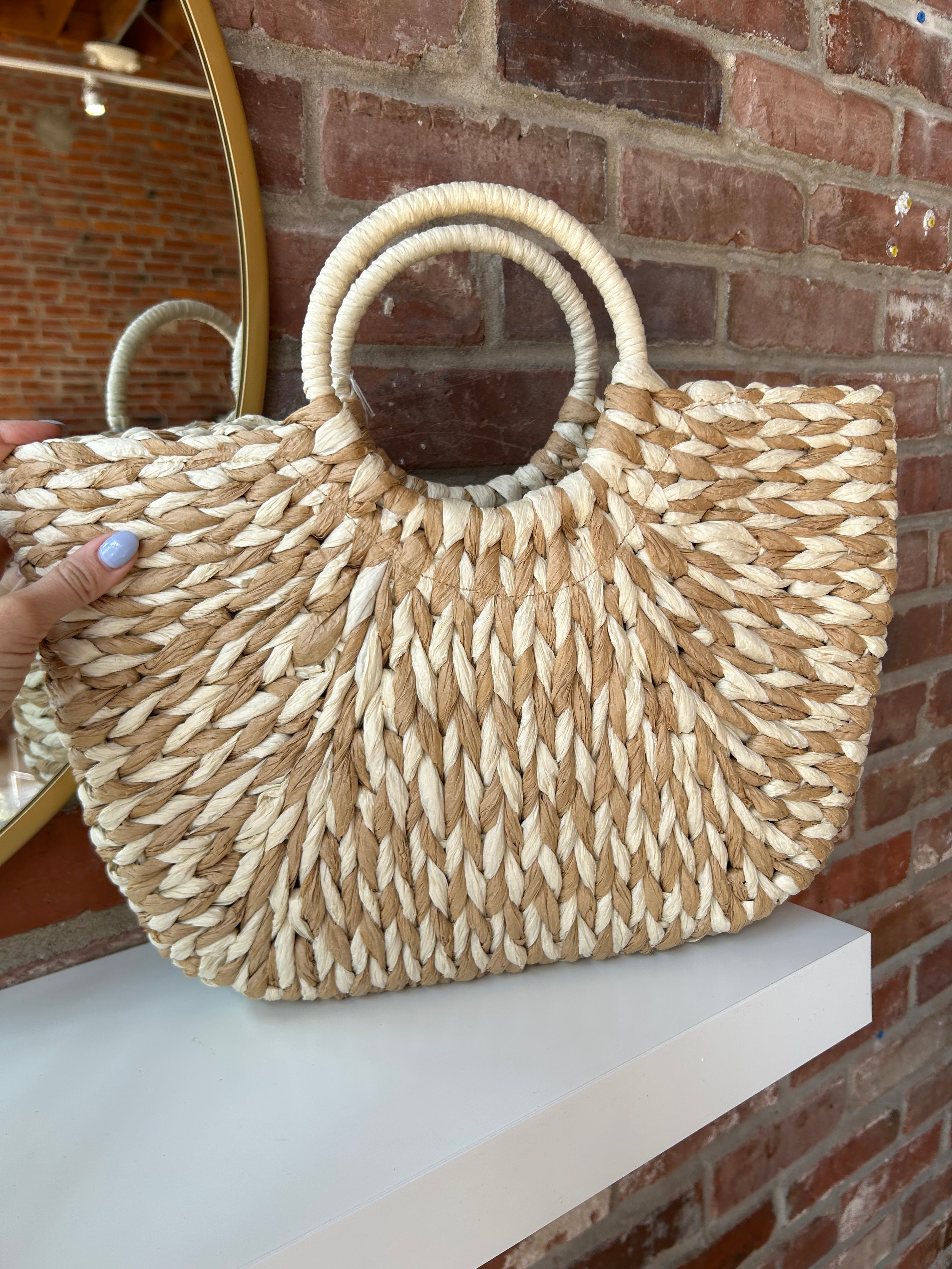 Tan and beige straw your bag. Perfect for carrying all summer long. 