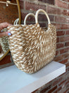 Tan and beige straw your bag. Perfect for carrying all summer long. 