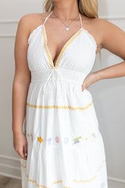 White halter maxi dress with multicolored embroidered seashells. 
