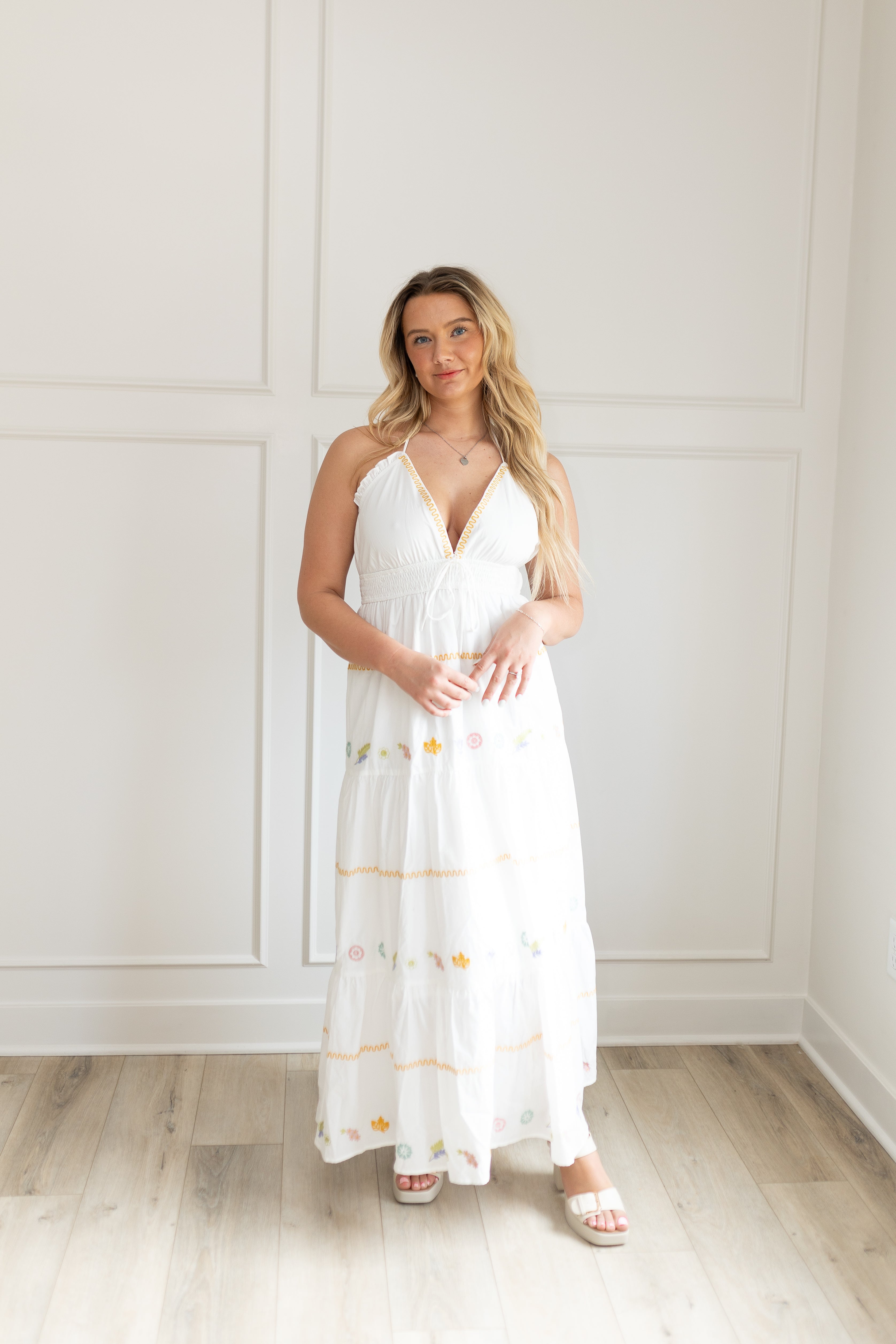 White halter maxi dress with multicolored embroidered seashells. 