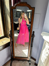 Hot pink checkered halter maxi dress with a cutout and flowy skirt