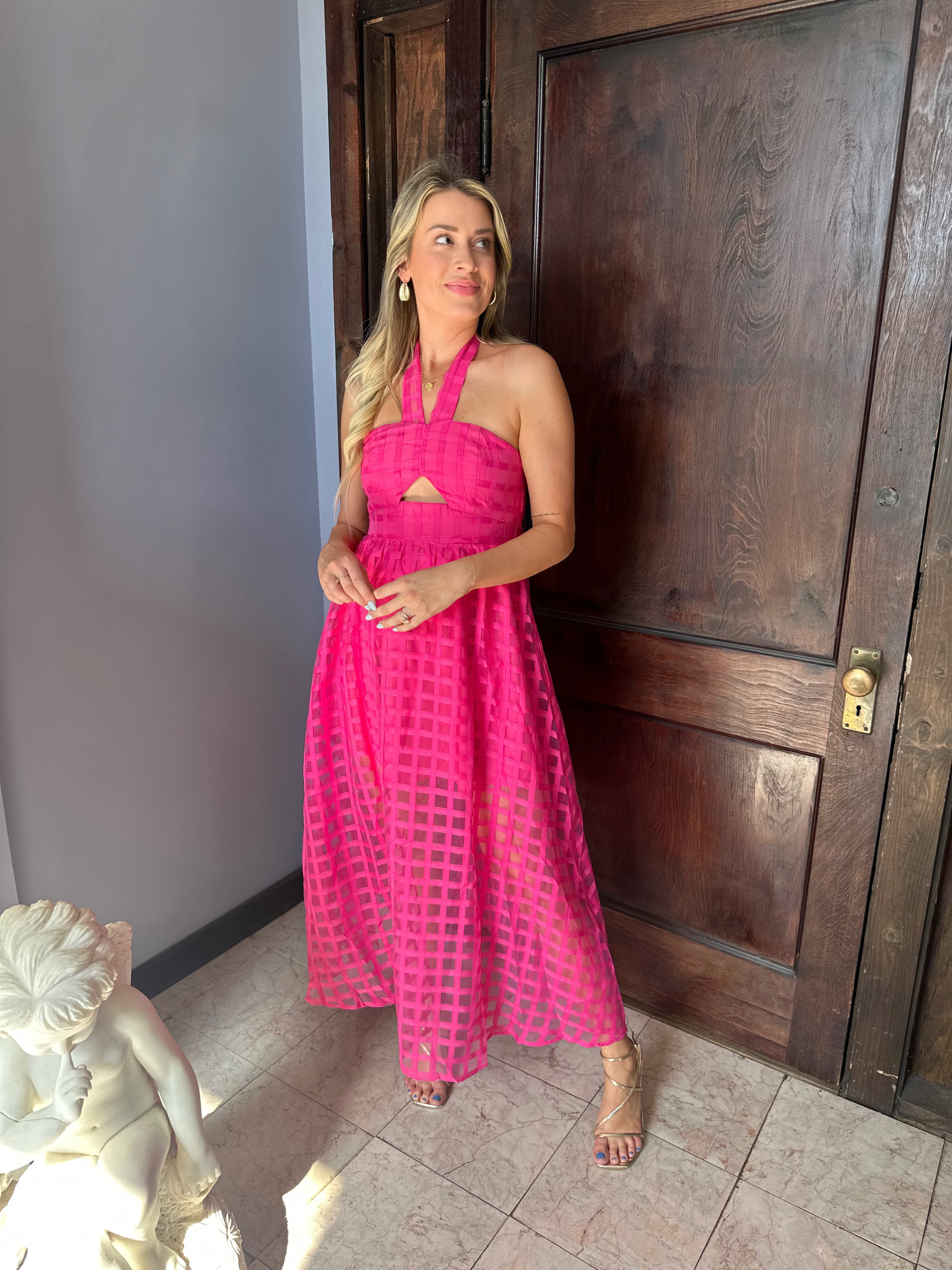 Hot pink checkered halter maxi dress with a cutout and flowy skirt