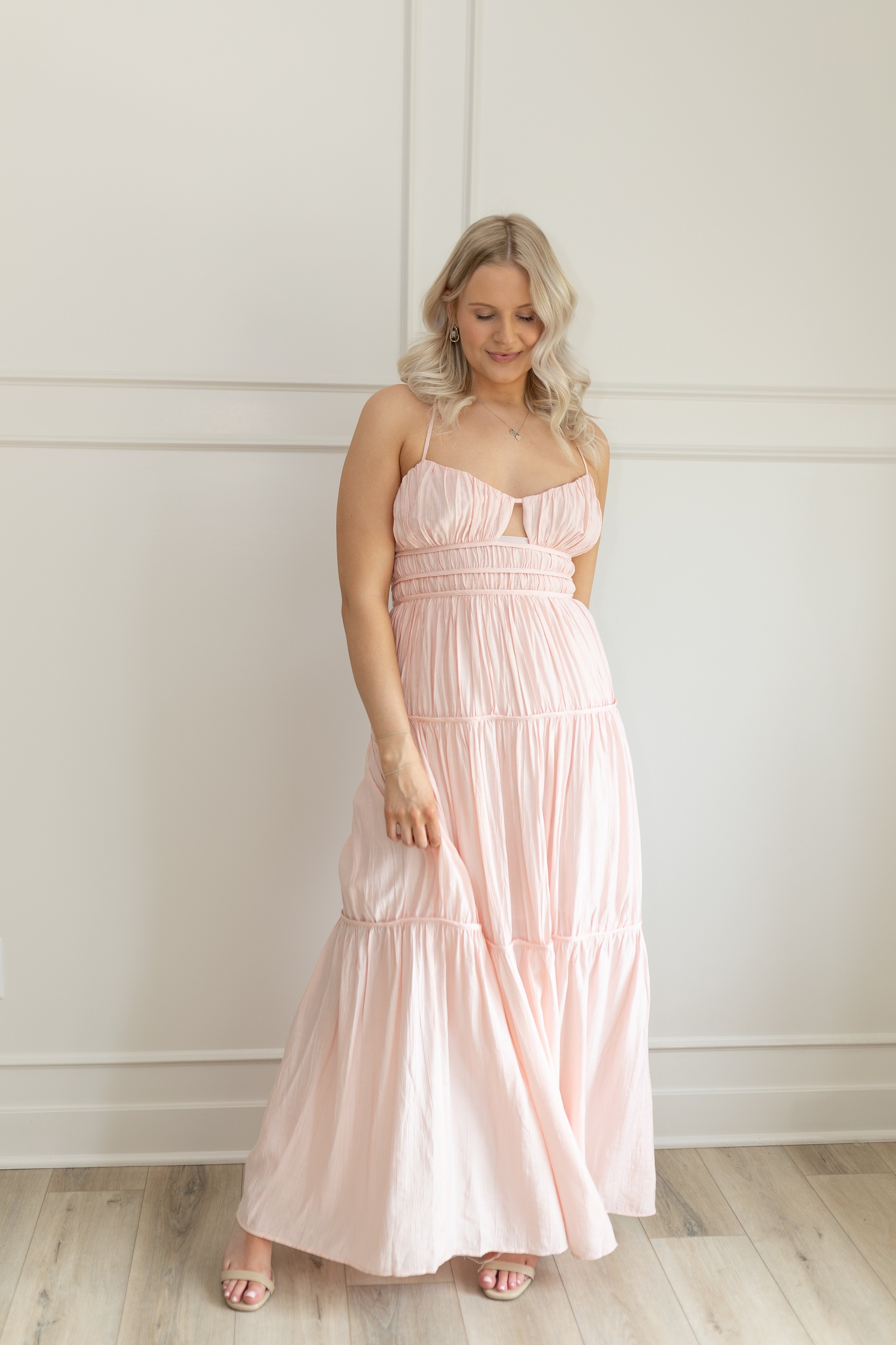 Pink ruched maxi dress with strappy back and tiered flowy skirt