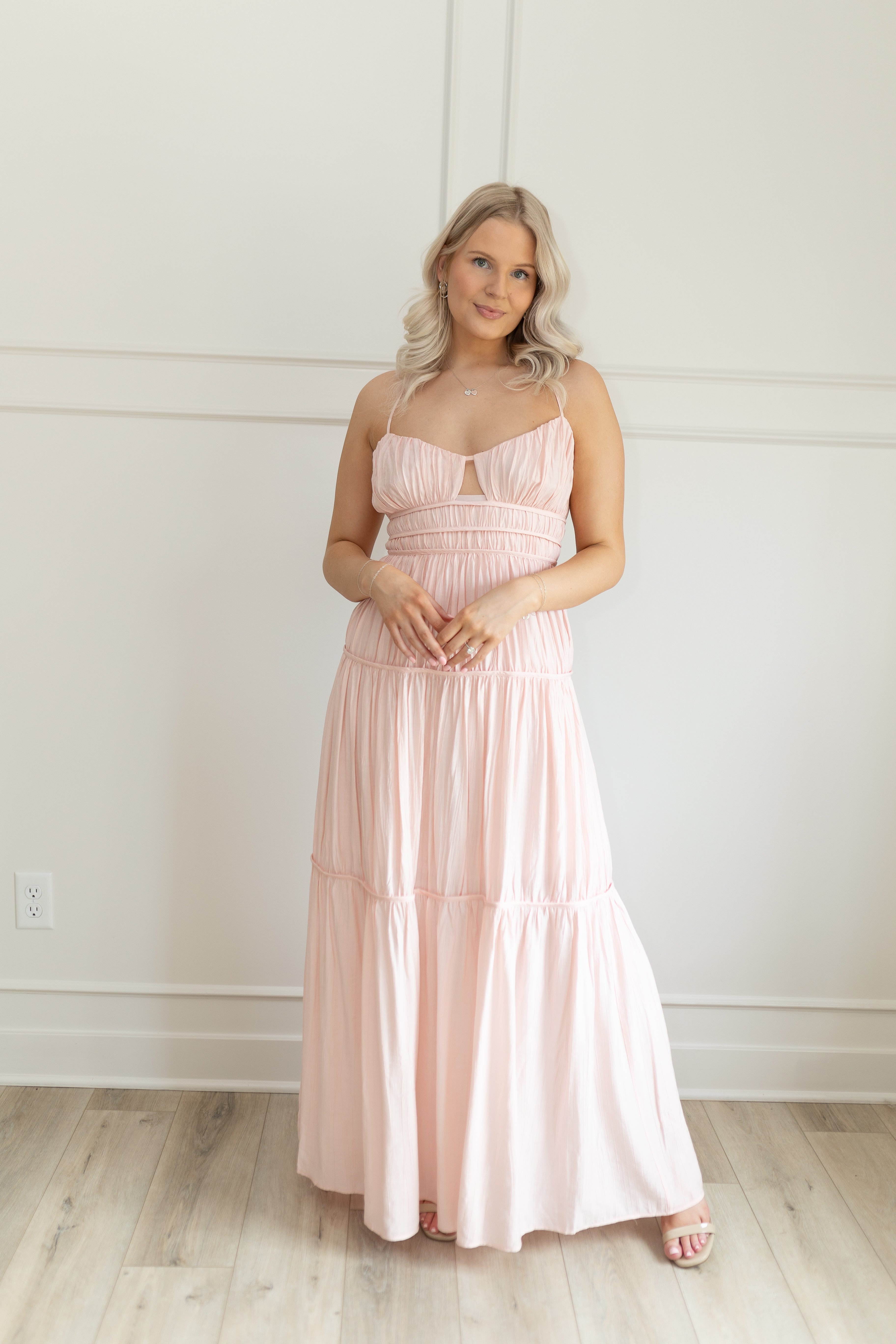 Pink ruched maxi dress with strappy back and tiered flowy skirt