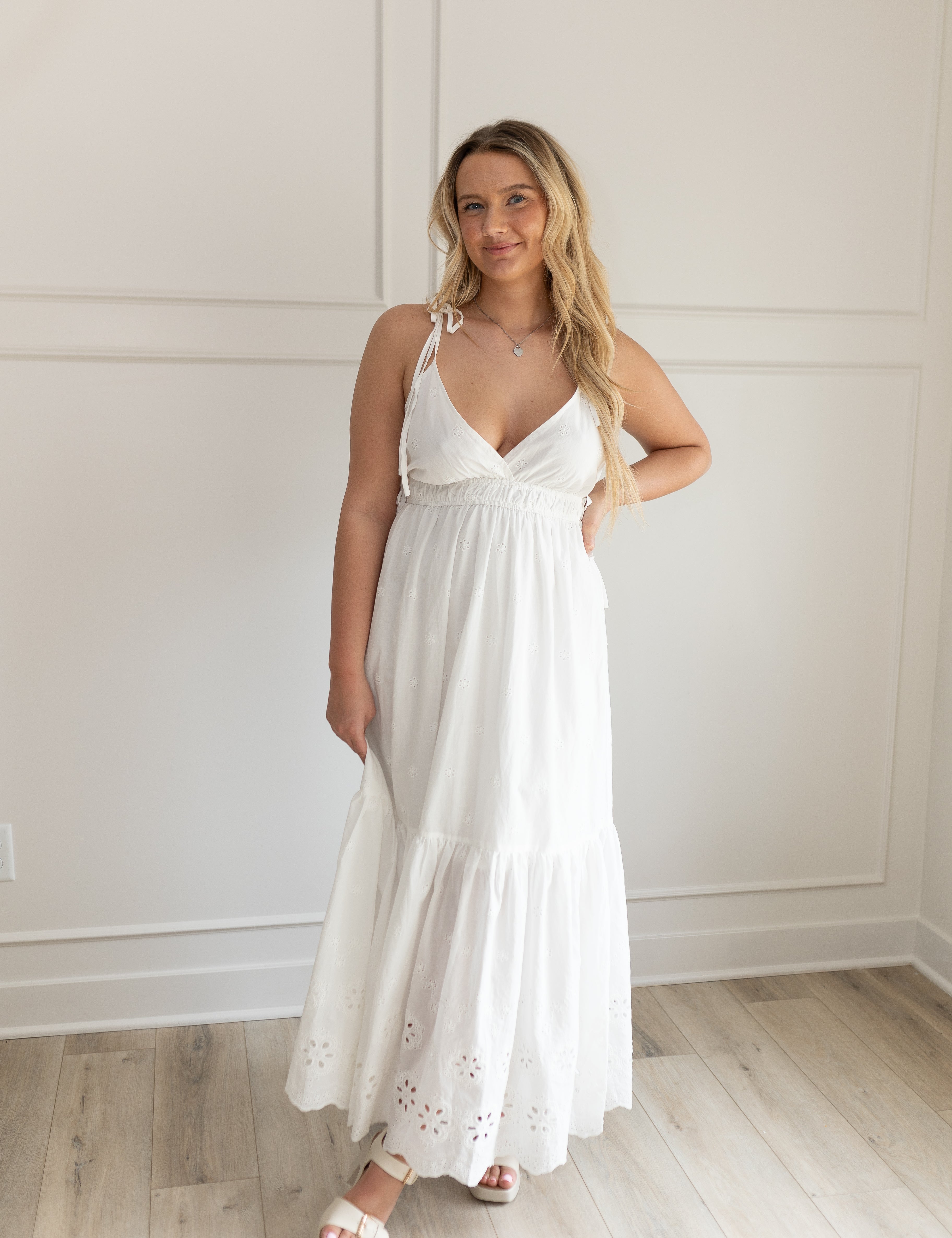White maxi dress with eyelet embroidered pattern. Adjustable for straps. Also comes in lavender. 