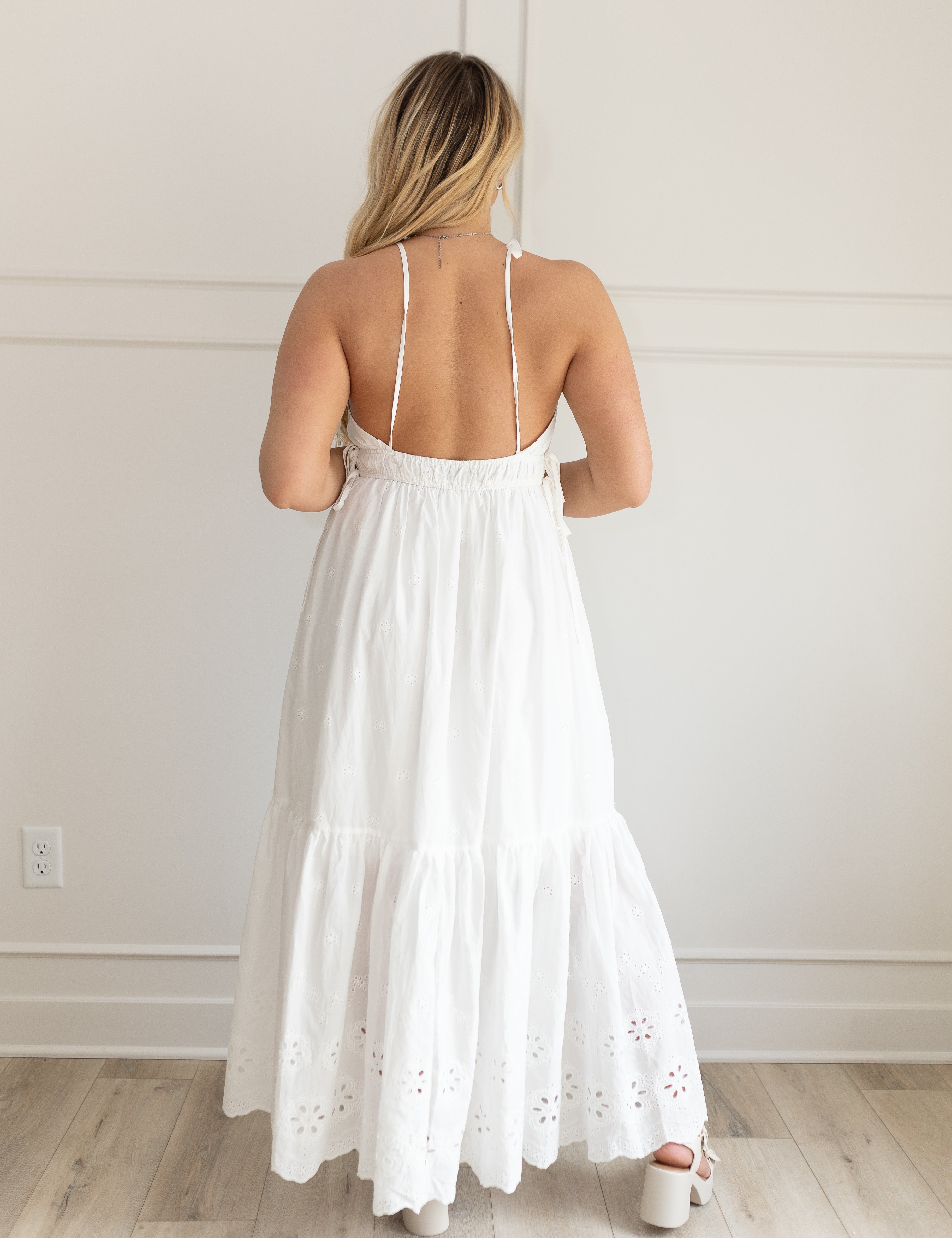White maxi dress with eyelet embroidered pattern. Adjustable for straps. Also comes in lavender. 