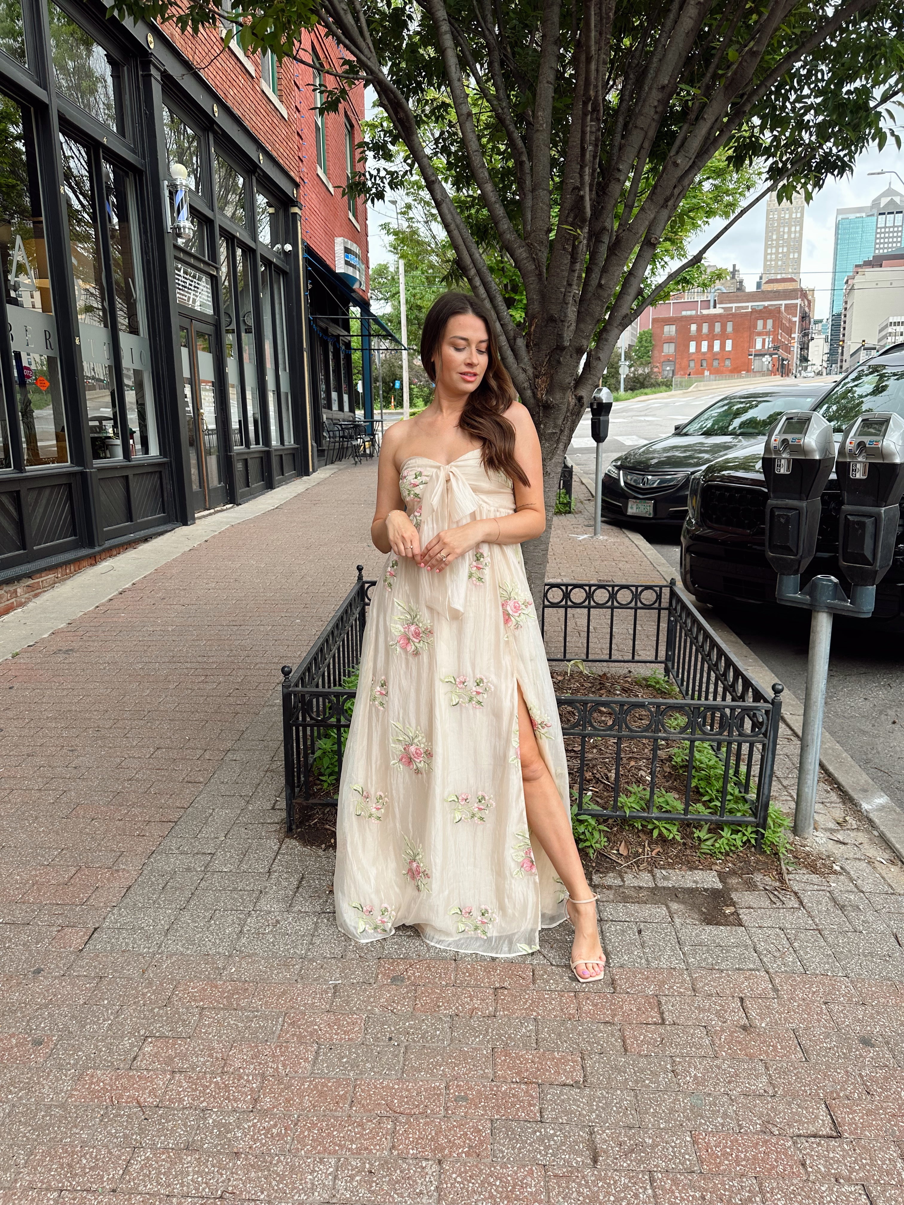 Strapless beige chiffon maxi dress with pink floral embroidery and leg slit