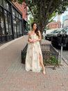 Strapless beige chiffon maxi dress with pink floral embroidery and leg slit
