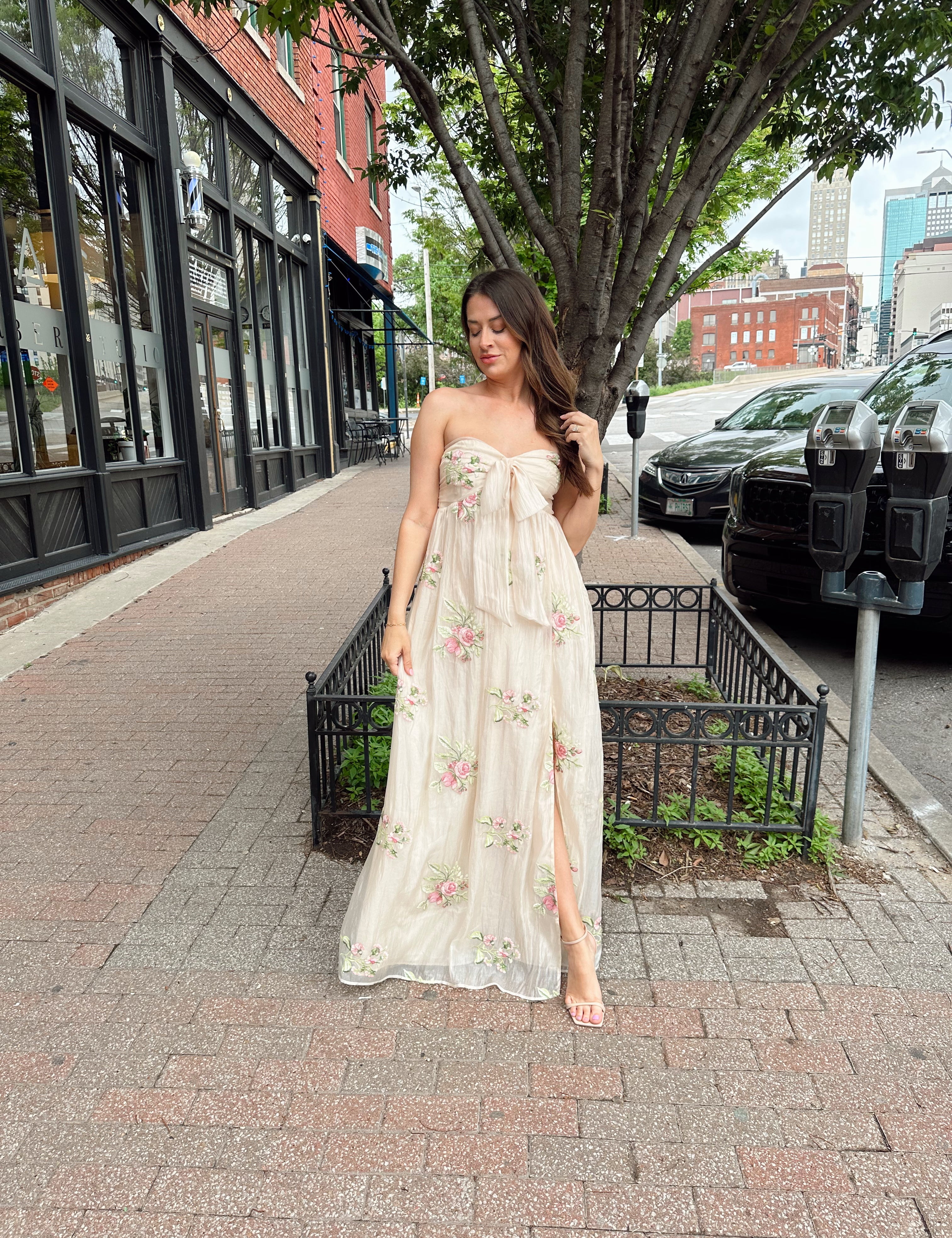 Strapless beige chiffon maxi dress with pink floral embroidery and leg slit
