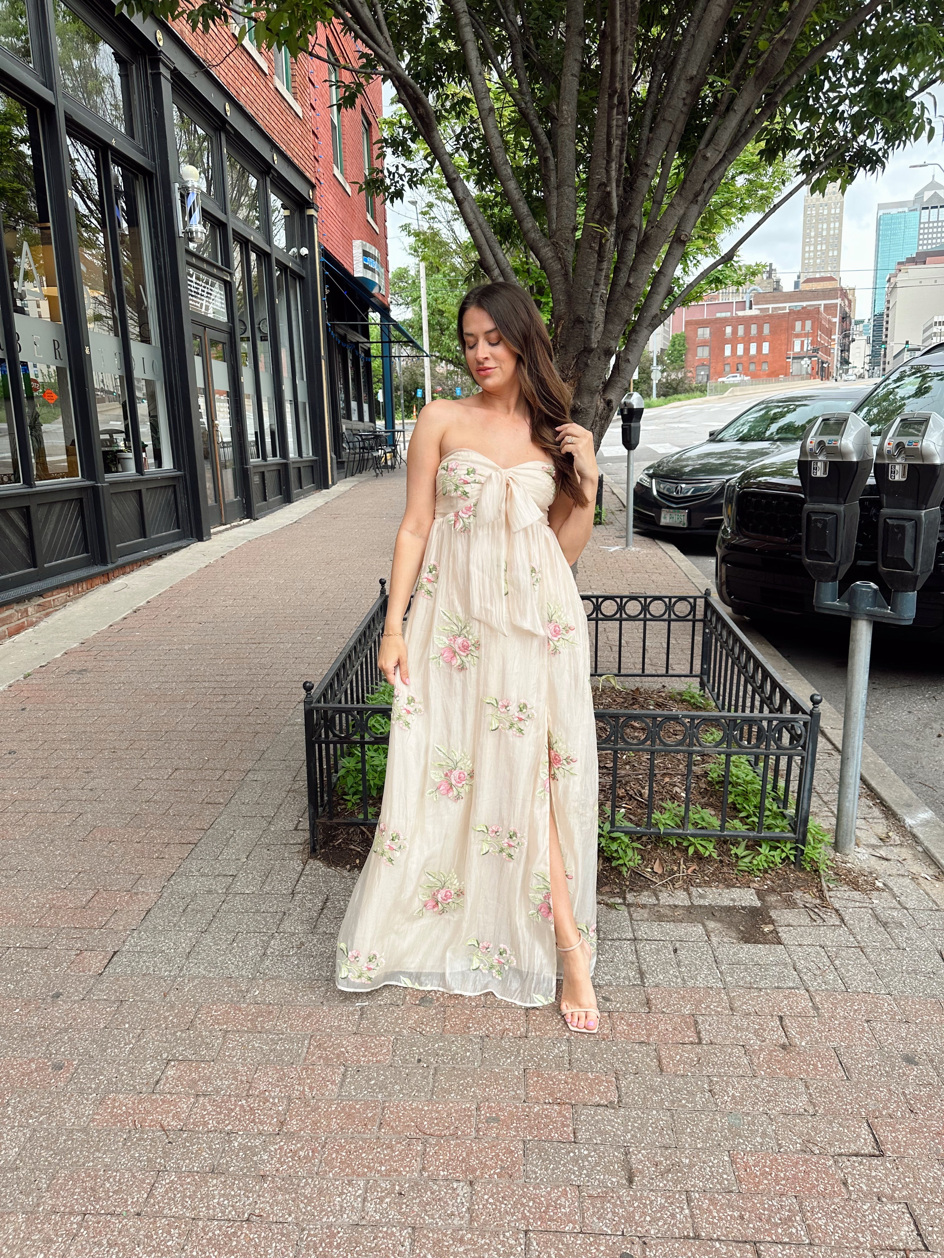 Strapless beige chiffon maxi dress with pink floral embroidery and leg slit